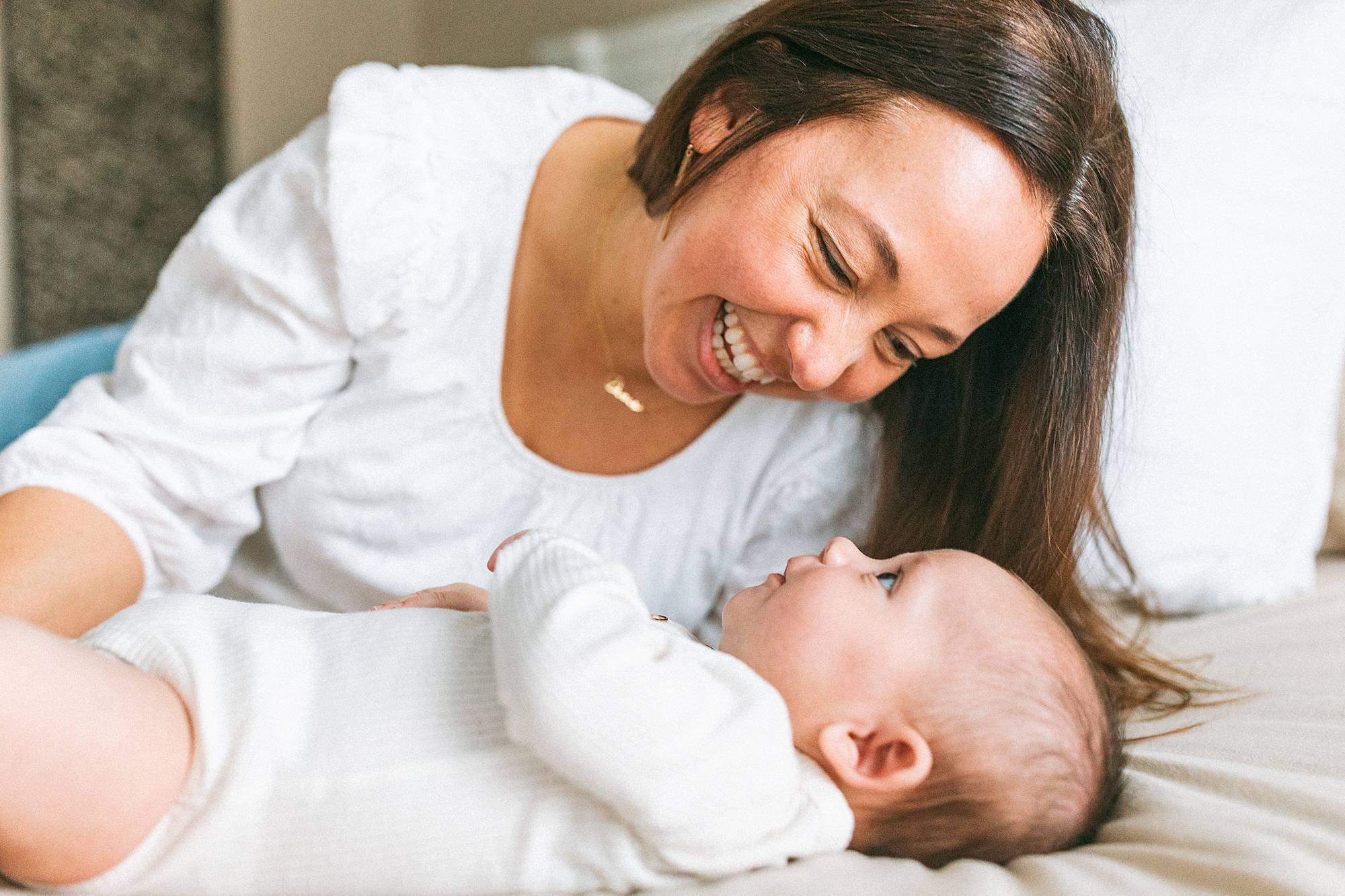 mom looking at baby lovingly photo