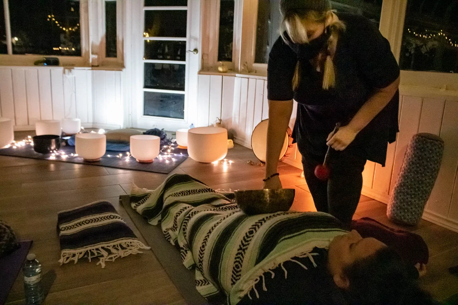  Following a quick guided meditation, the host of the sound bathing event, Scherri Dickson walked around participants with a handcrafted singing bowl and slowly placed it on the participant's stomachs so they absorb the vibrations of the sound. 