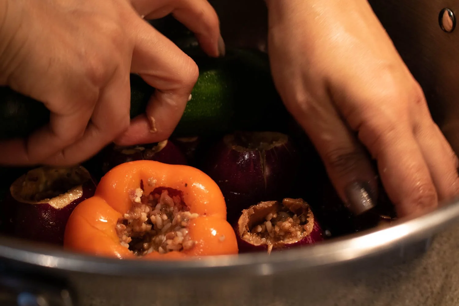  After all the vegetable pieces of the ‘Mahshi’ is stuffed with the rice mixture, they are placed inside the pot in an organized manner to make sure the pieces are holding each other so they don’t move while the food is cooking. 