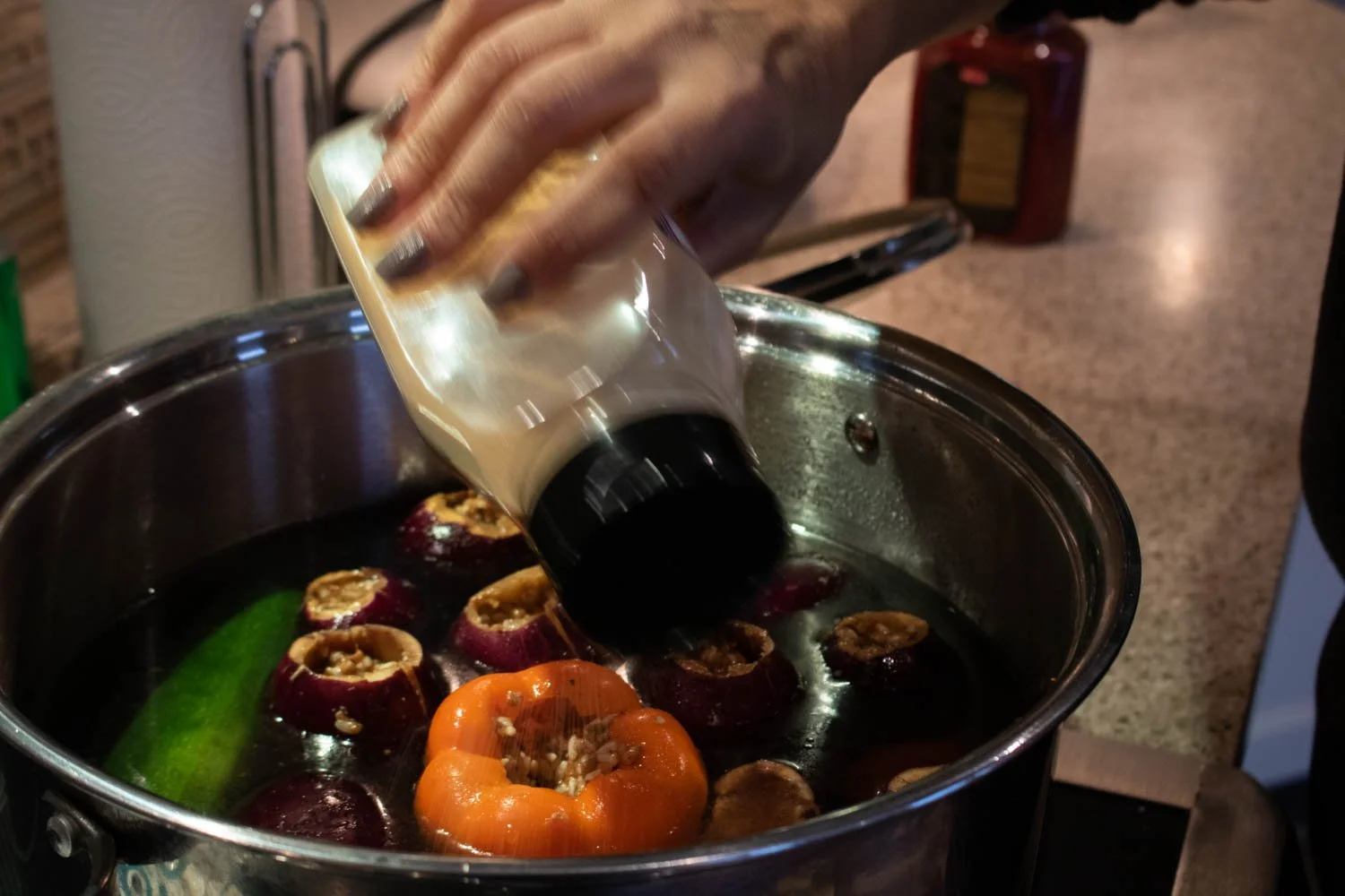  The vegetable-filled pot is filled with water, seasoning, and tomato paste and is left to boil on high for 15 minutes. Then the cook changed the temperature to low for the next 45 minutes. 