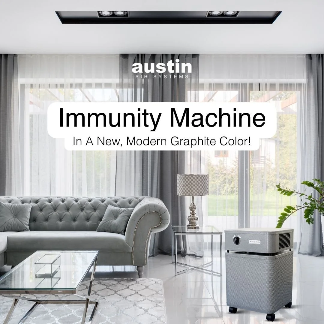 Austin Air Immunity Machine air purifier operating in a living room to remove mold fragments and carcinogenic VOCs