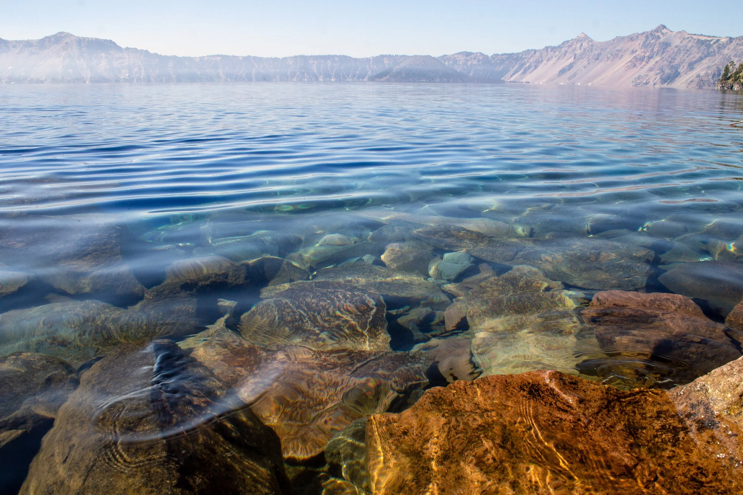 Rocks of lakebed of Crater Lake through clear water