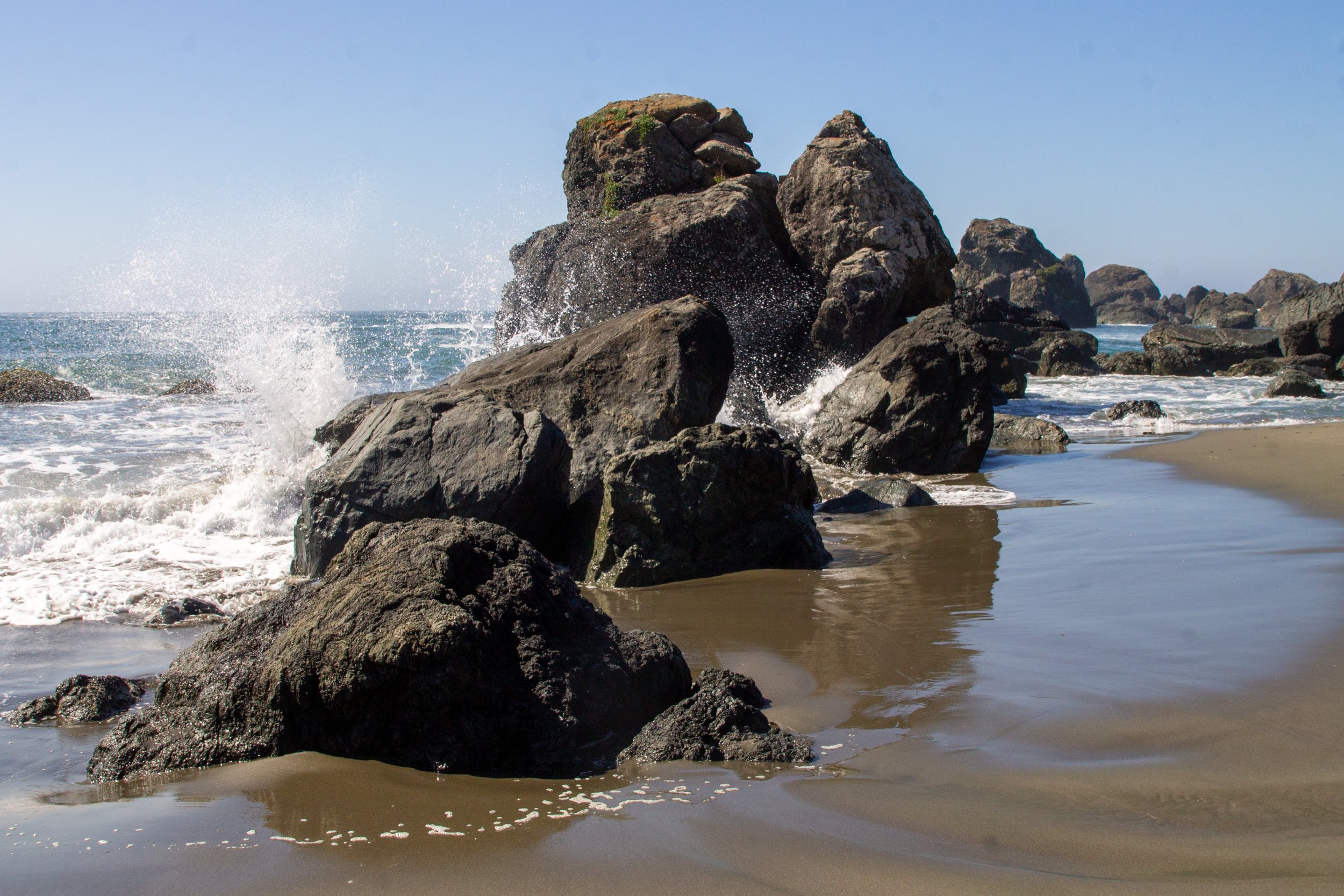 Waves hit the sea stacks on Lone Ranch Beach