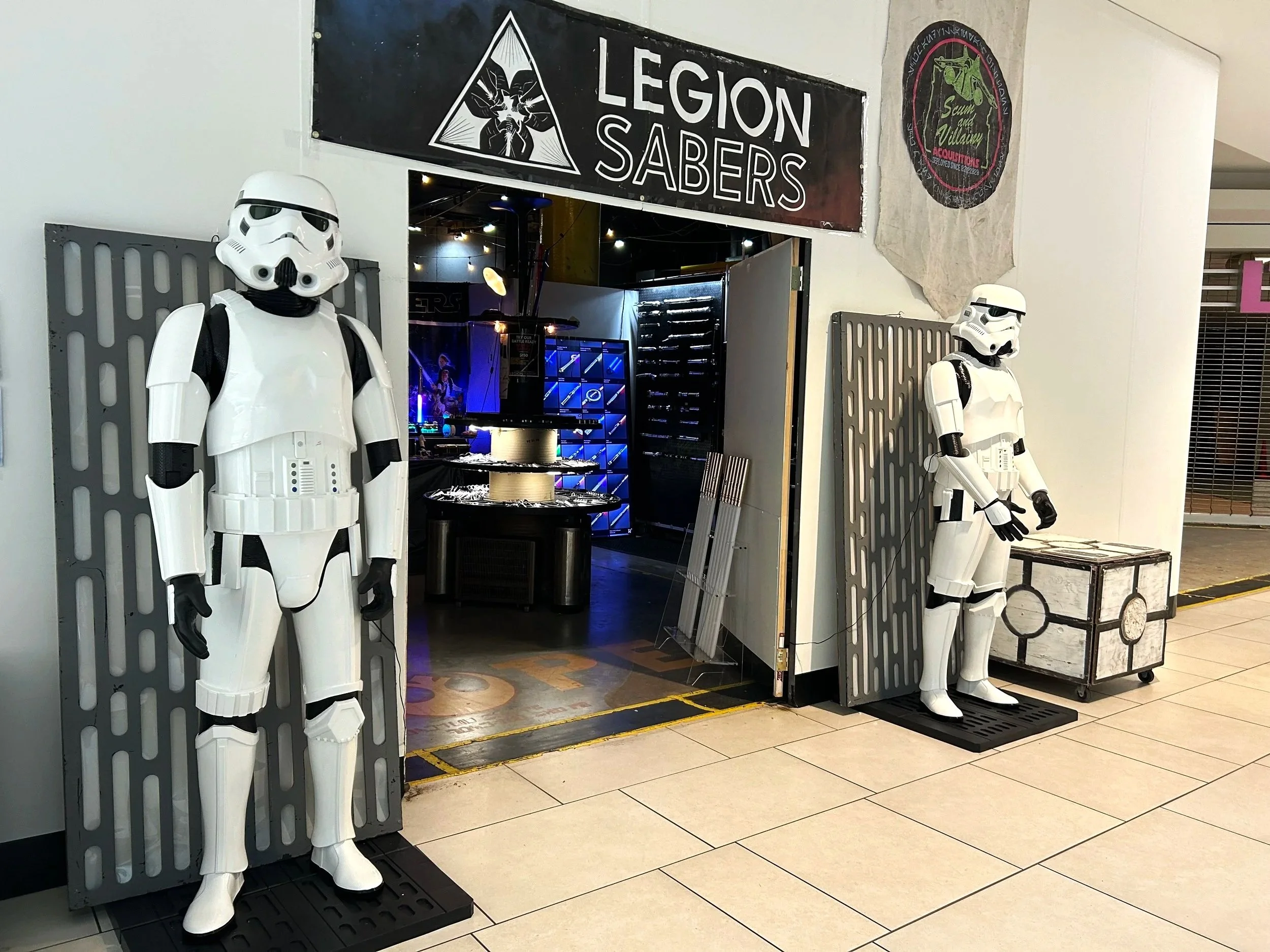 Storm troopers in front of light saber store