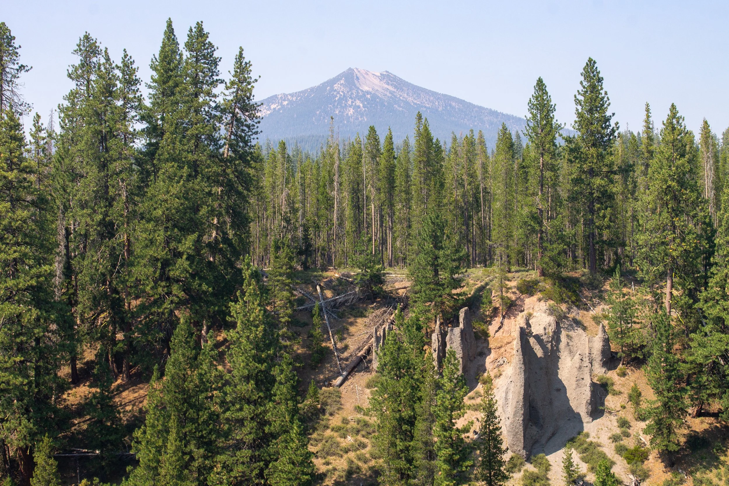 Mount Scott above forest with pinnacles of ash flow tuff