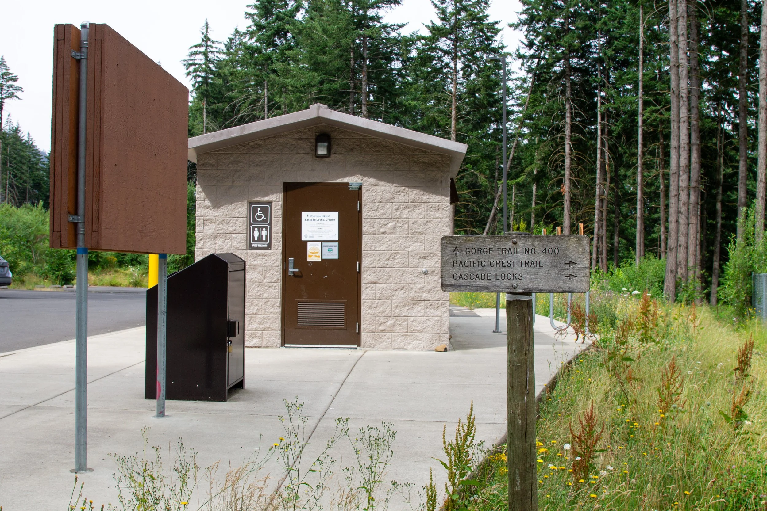 Restroom building next to parking lot