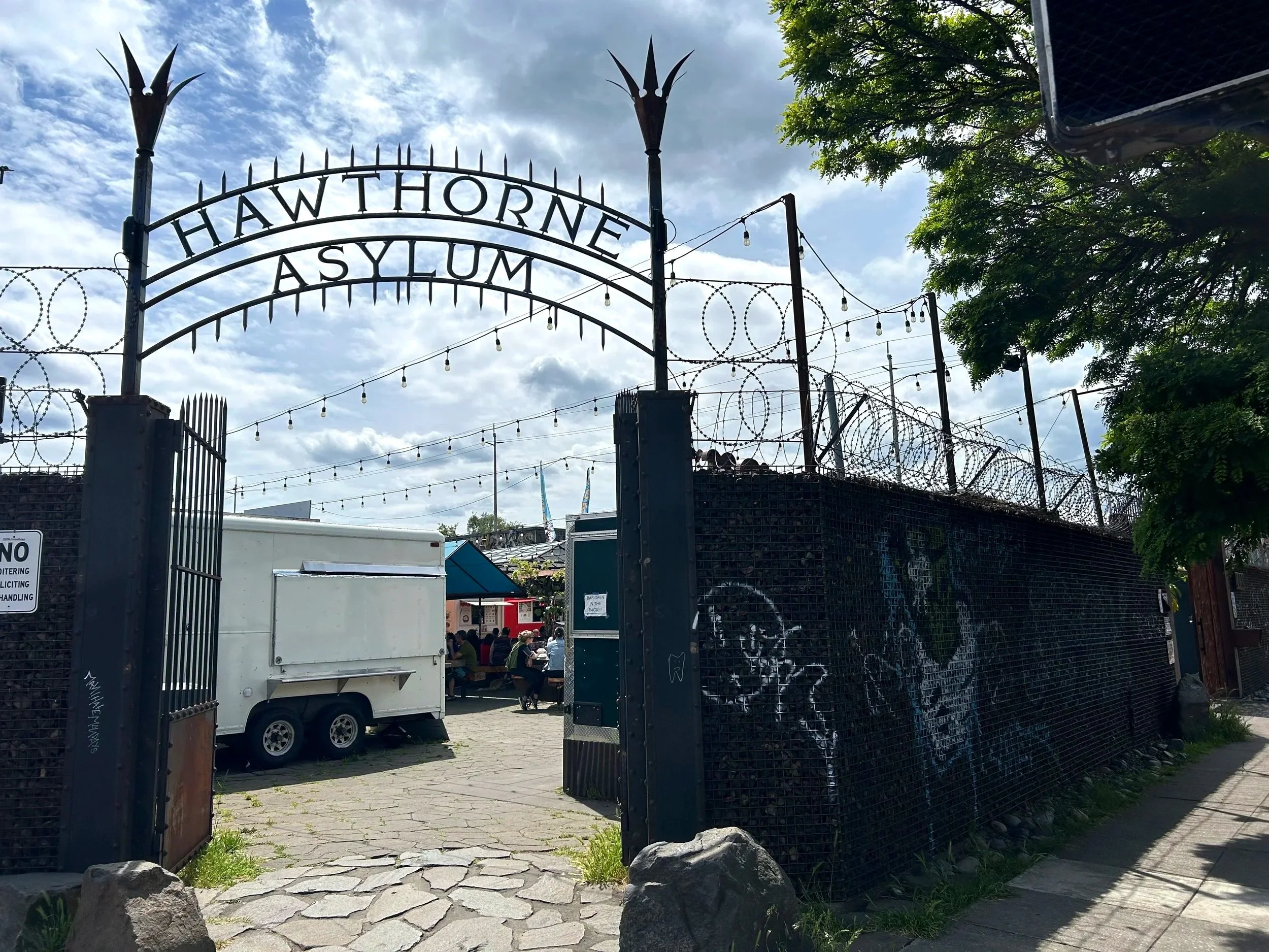 Cool metal sign over entrance to food cart pod