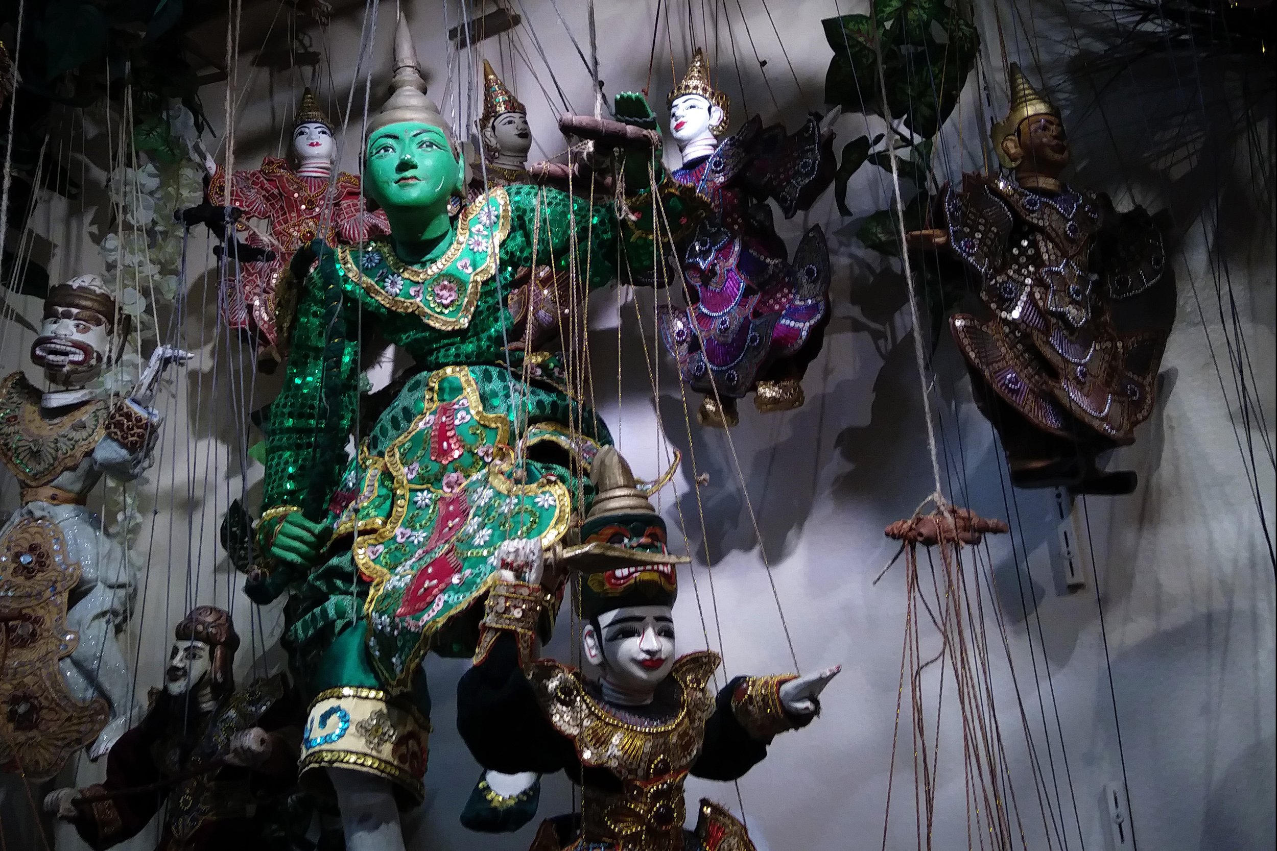 Interesting puppets hang from ceilling