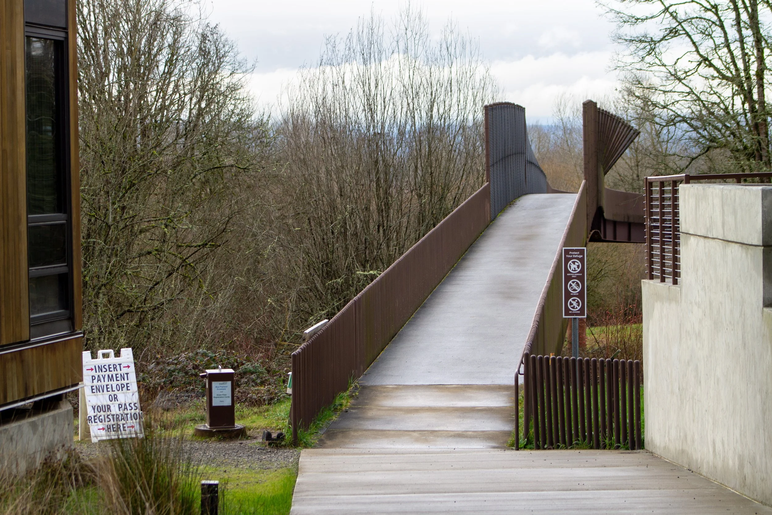 Sidewalk to bridge above railroad tracks