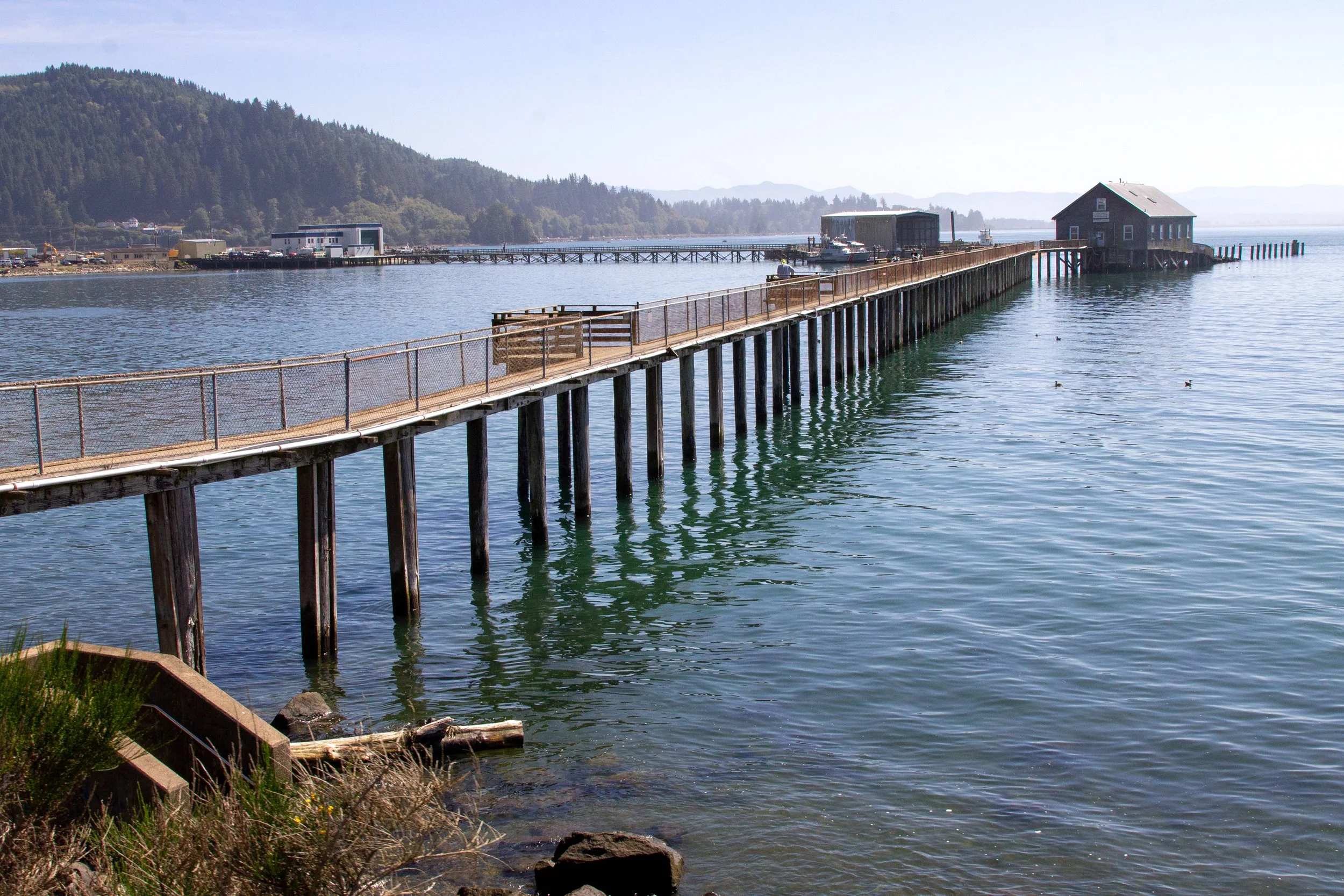 Old coast guard station at end of long pier