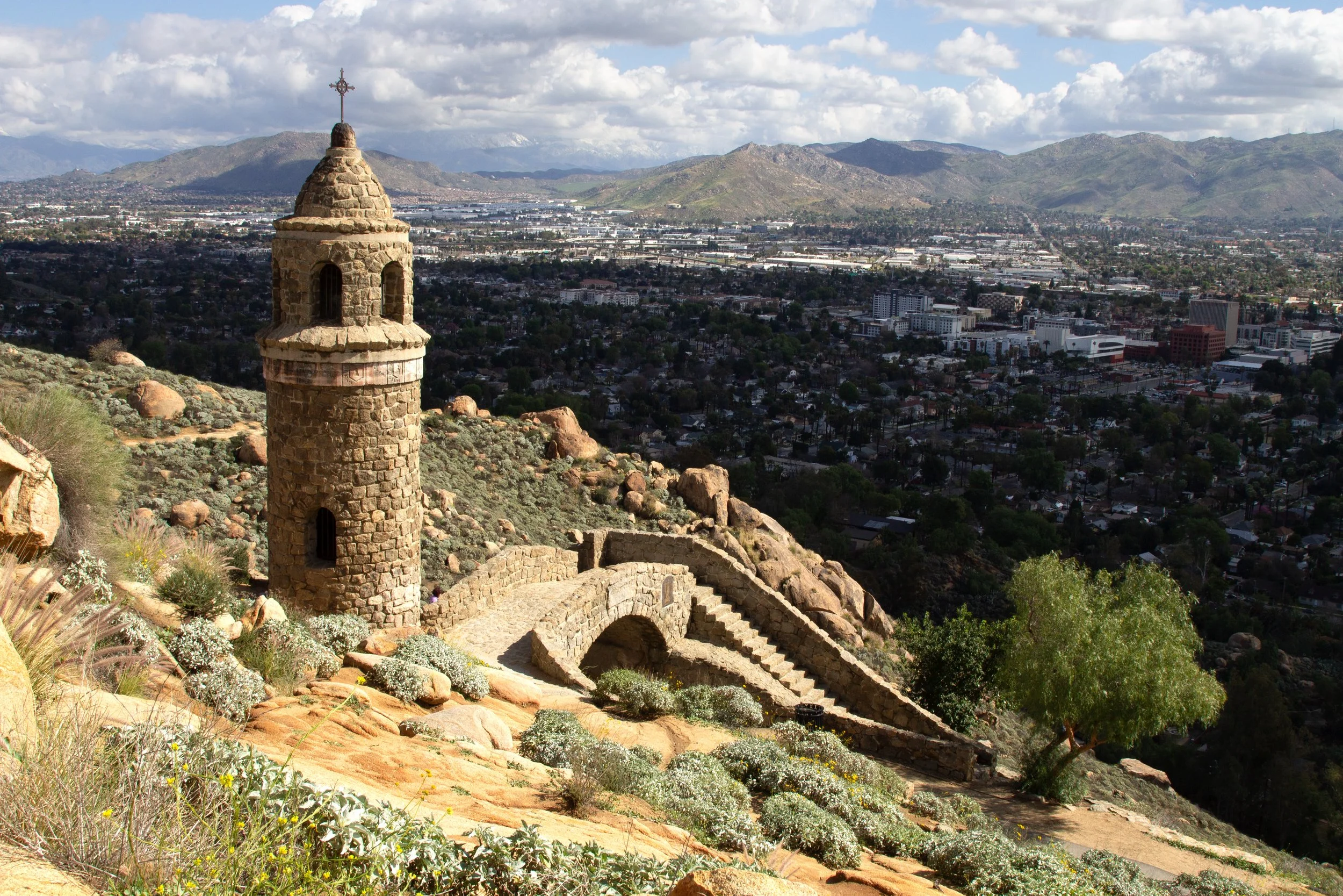 Stone bridge and tower and mountain overlooking Riverside