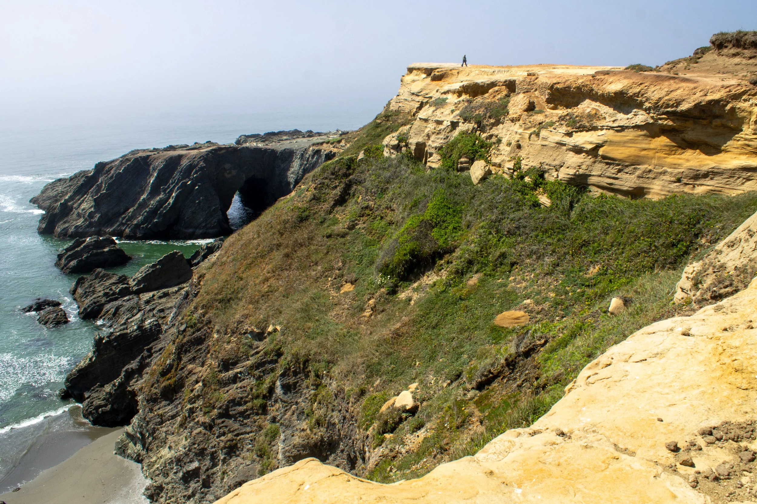 Person walks alone on peninsula
