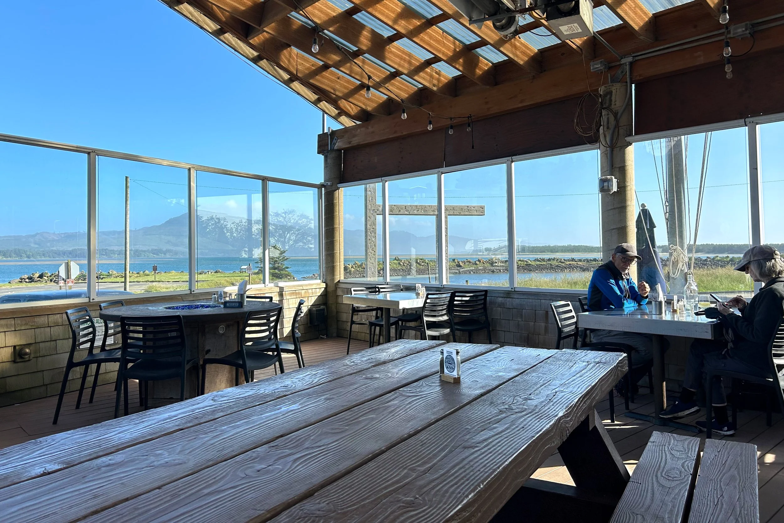 Tables with bay view in covered patio