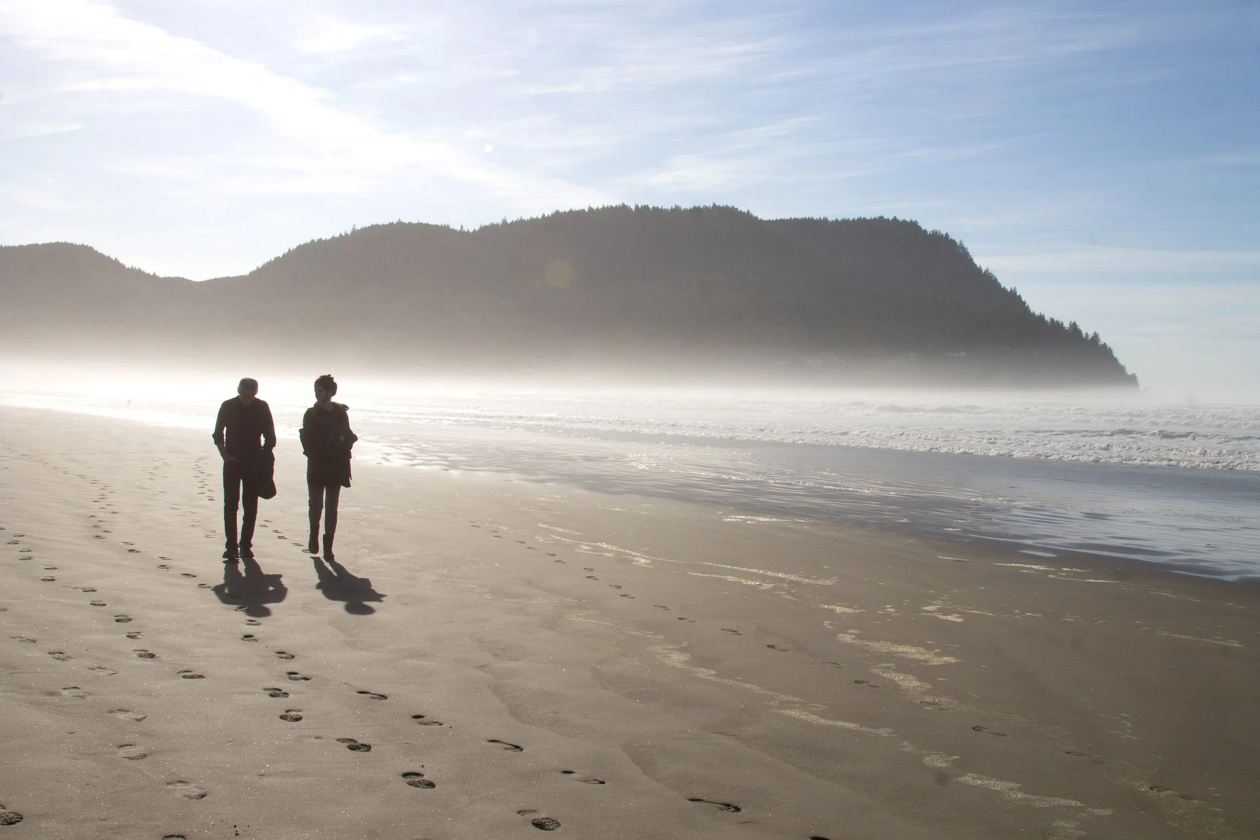 Two people walking on Seaside Beach