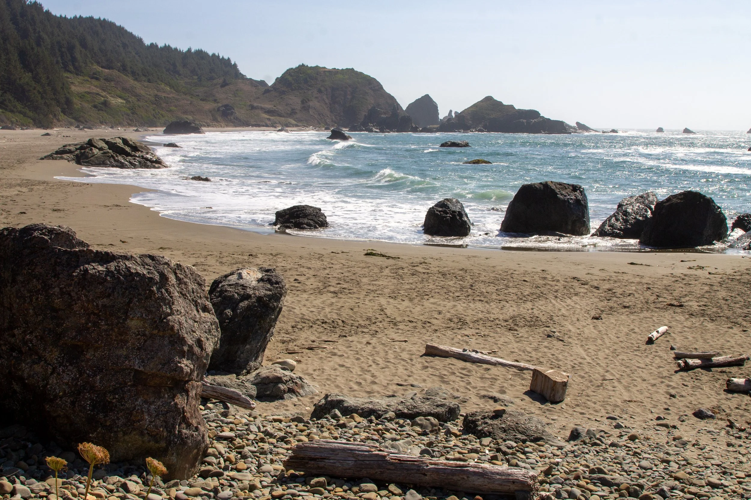 Sandy beach with rocks and sea stacks