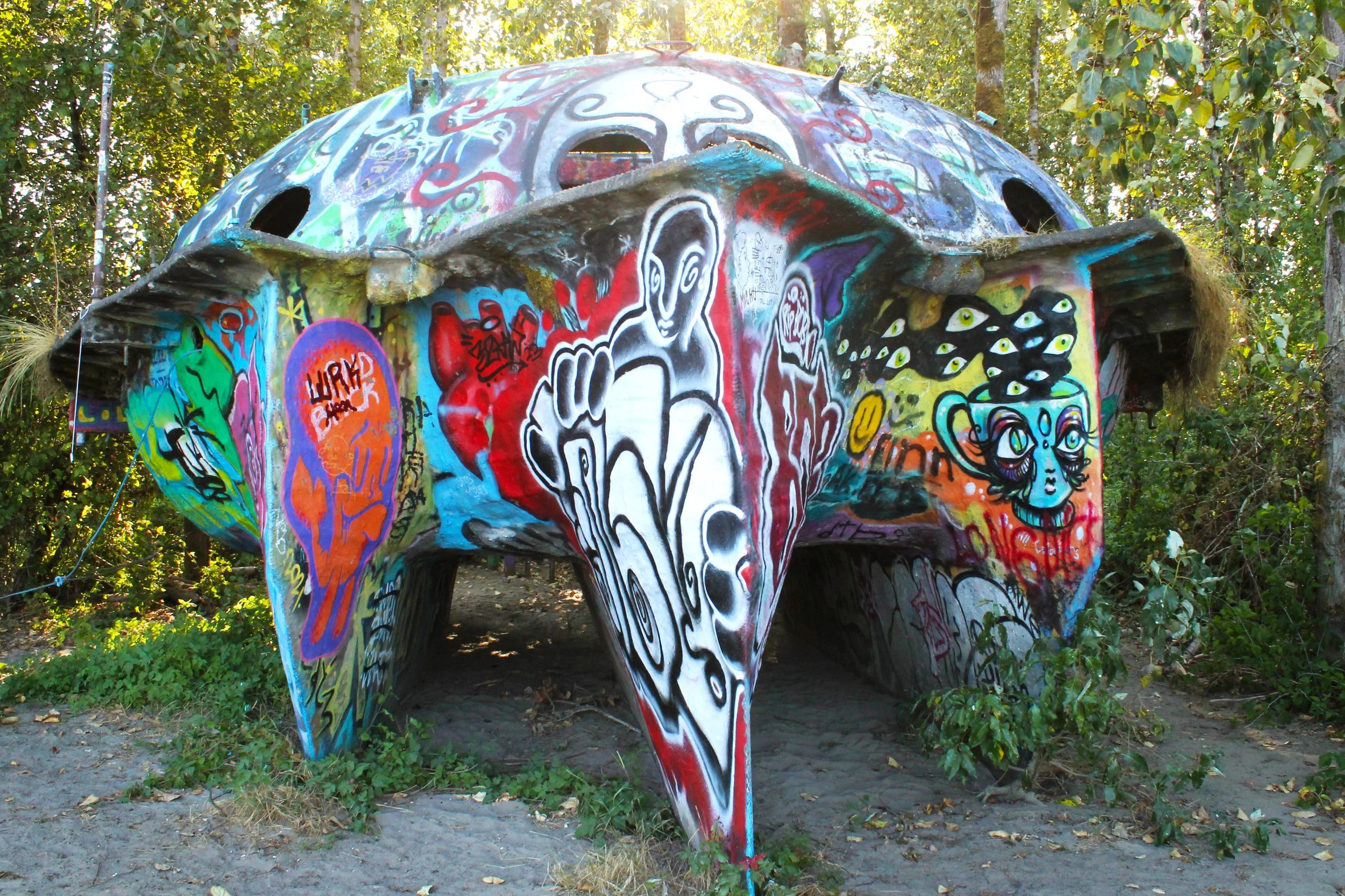 UFO-shaped boat hull with lots of graffiti