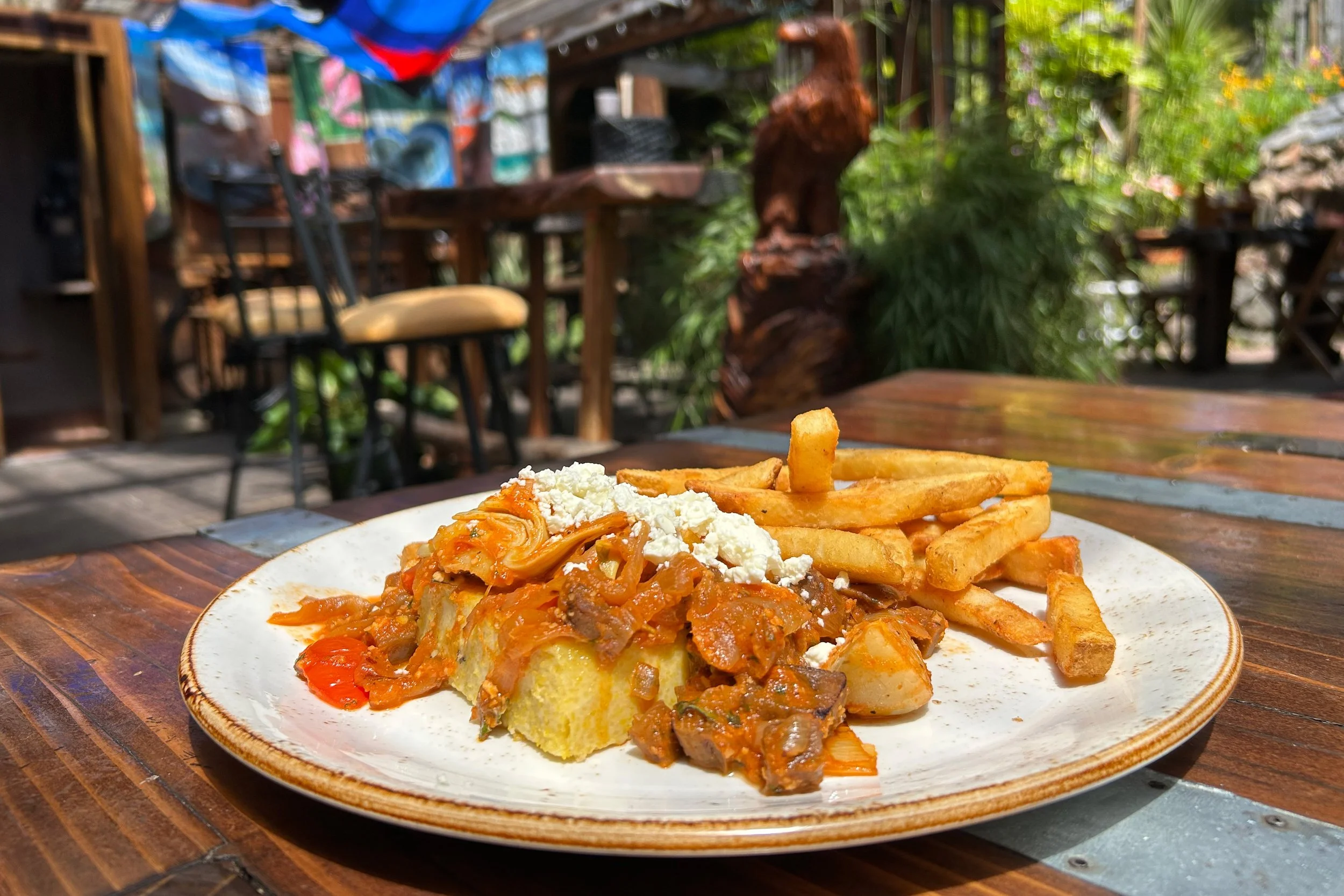 Plate of food on table in cheerful patio