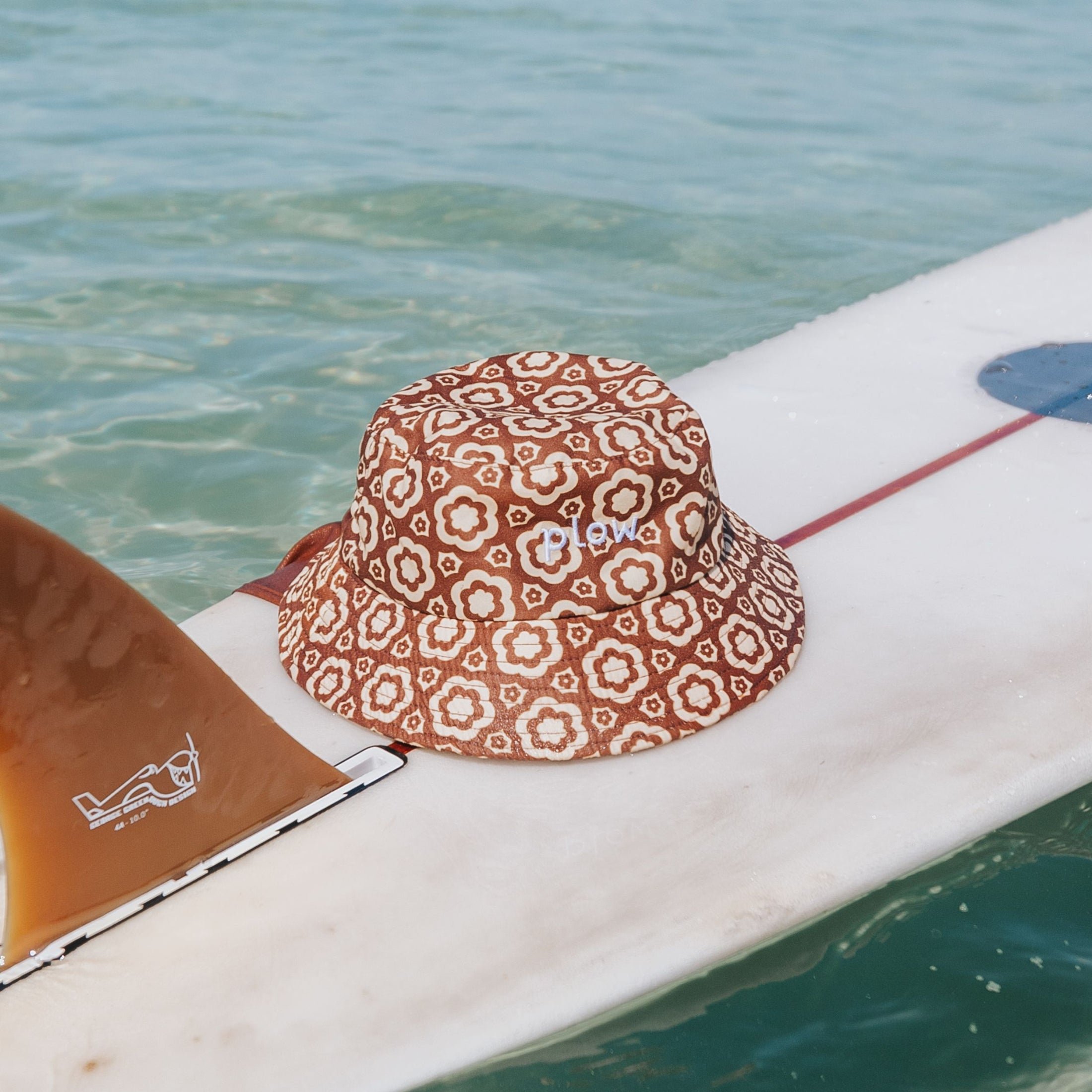 Bloomin Groover surf hat on surfboard