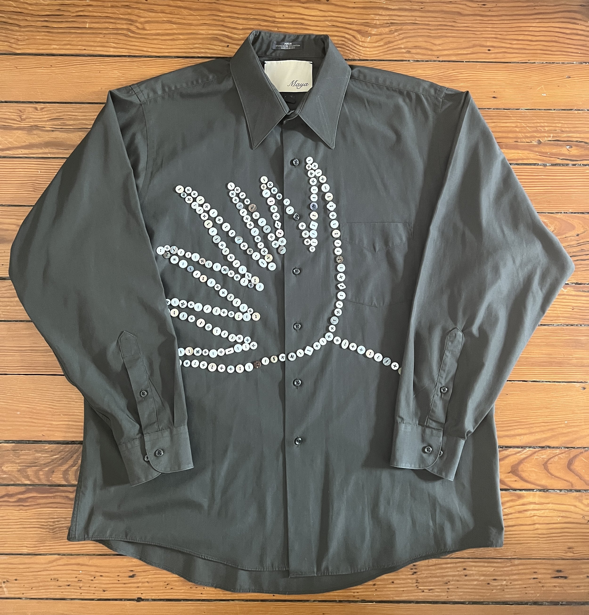 Button Shirt .27 | Size: 17-34 (men's XL) | A thoughtfully sourced second-hand Arrow button-up featuring an assortment of hand-sewn mother of pearl and shell buttons. Dark green. | $150 plus shipping, email mayashawcontact@gmail.com to purchase.