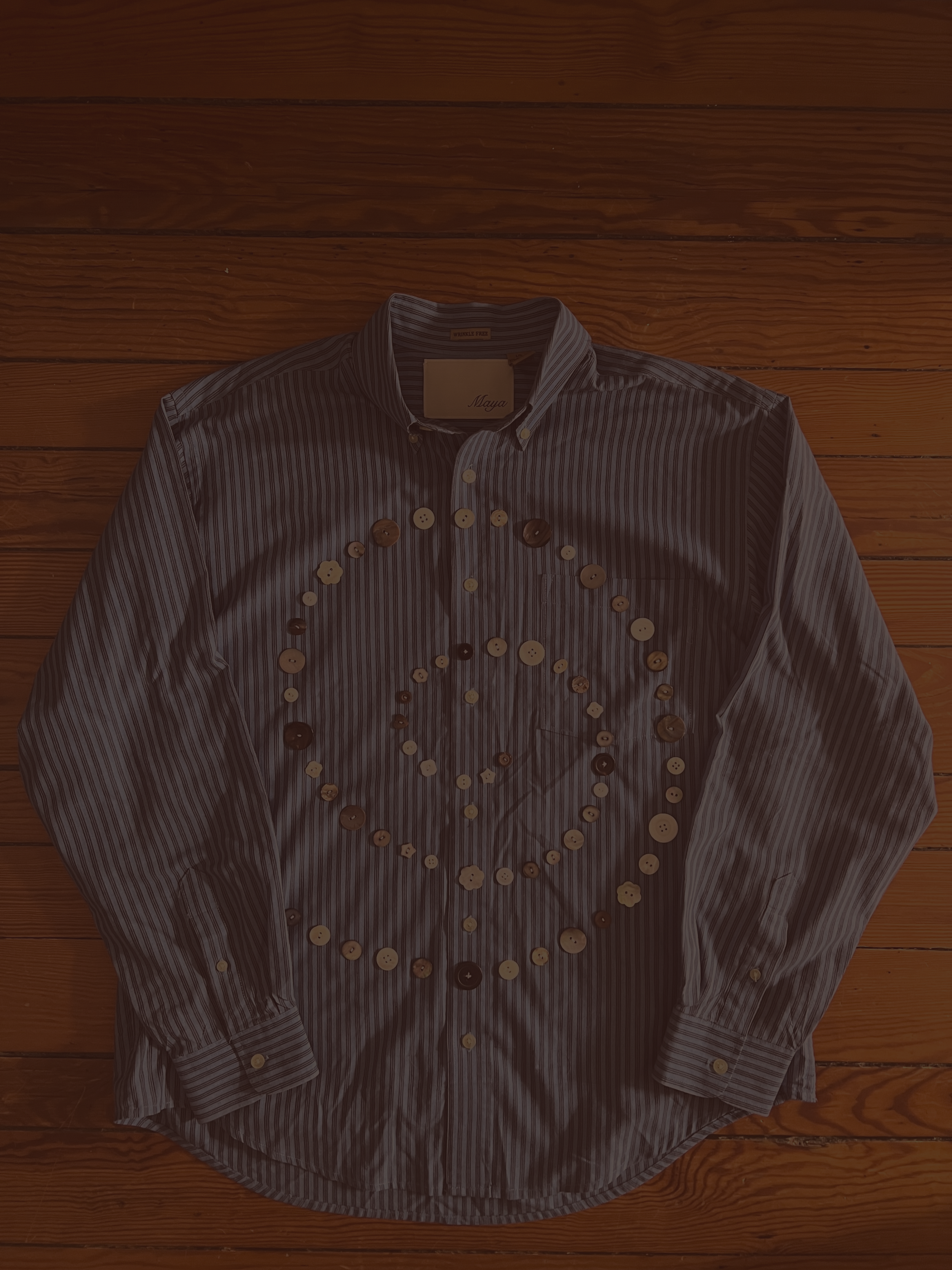 Button Shirt .37 | Size: Men's L | A thoughtfully sourced second-hand button-up featuring an assortment of hand-sewn buttons. Blue with stripes, this shirt is super soft. 
