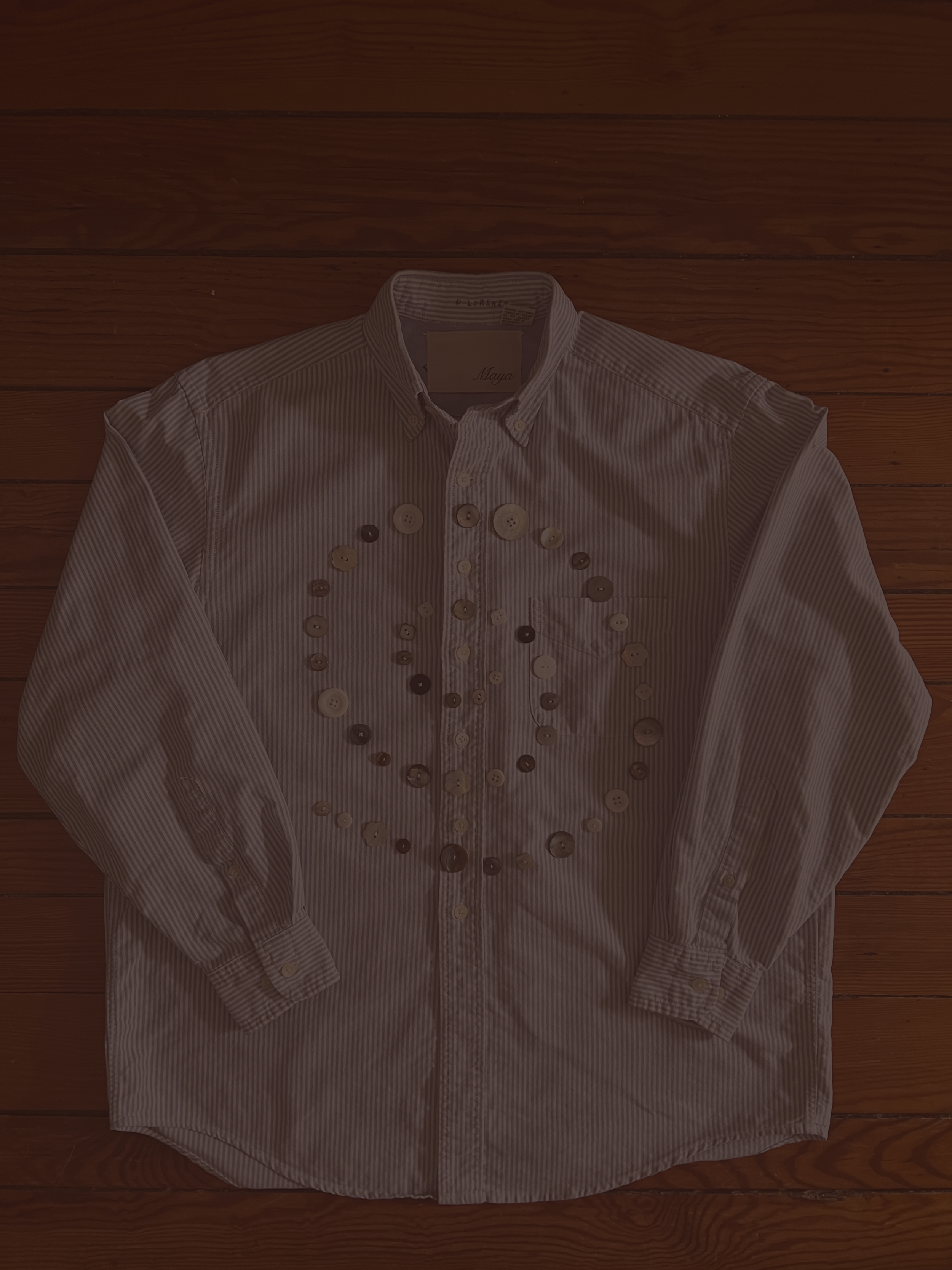 Button Shirt .36 | Size: Men's S | A thoughtfully sourced second-hand button-up featuring an assortment of hand-sewn buttons. Light blue with white stripes. 