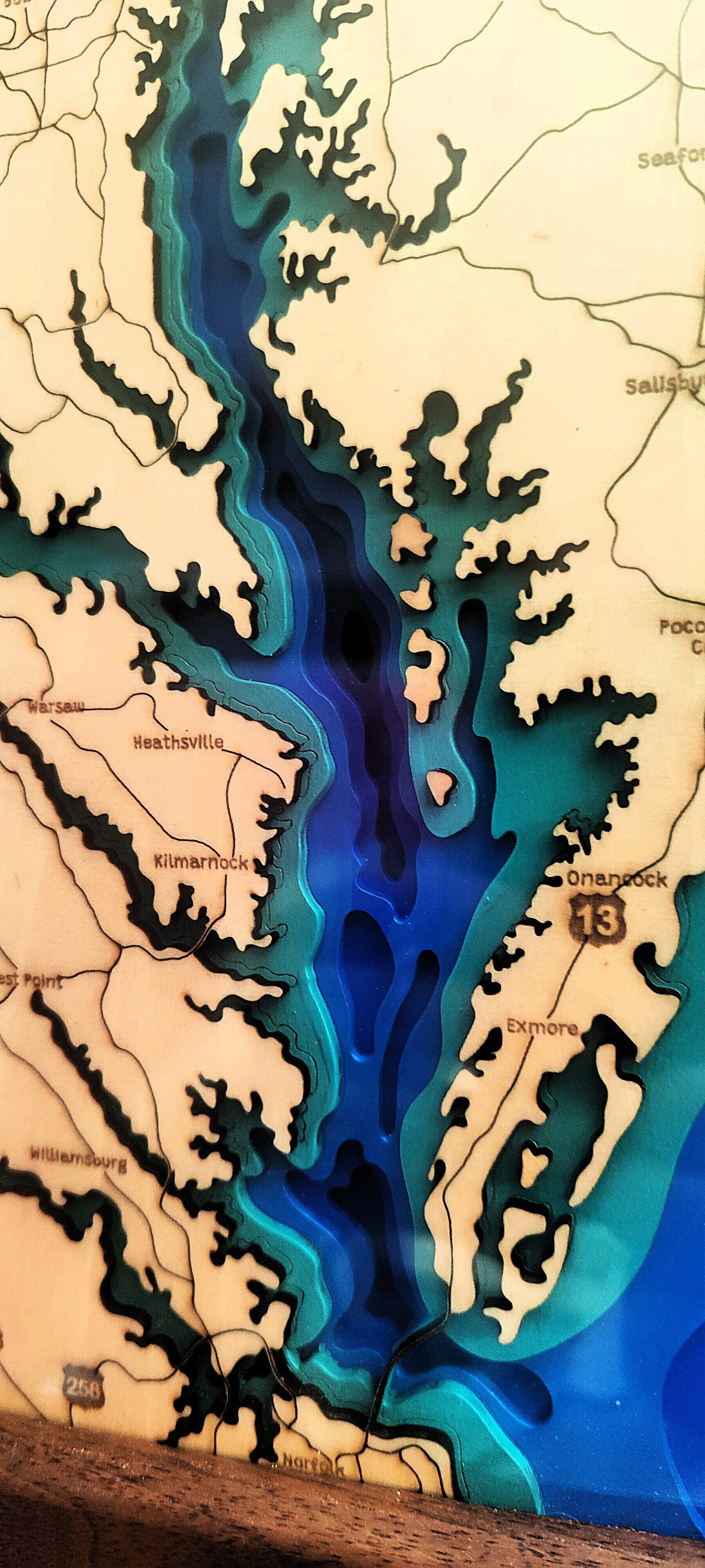 A detailed map of a reservoir or lake showing several inlets and islands, with surrounding towns labeled such as Heathsville, Kilmarnock, and Exmore.
