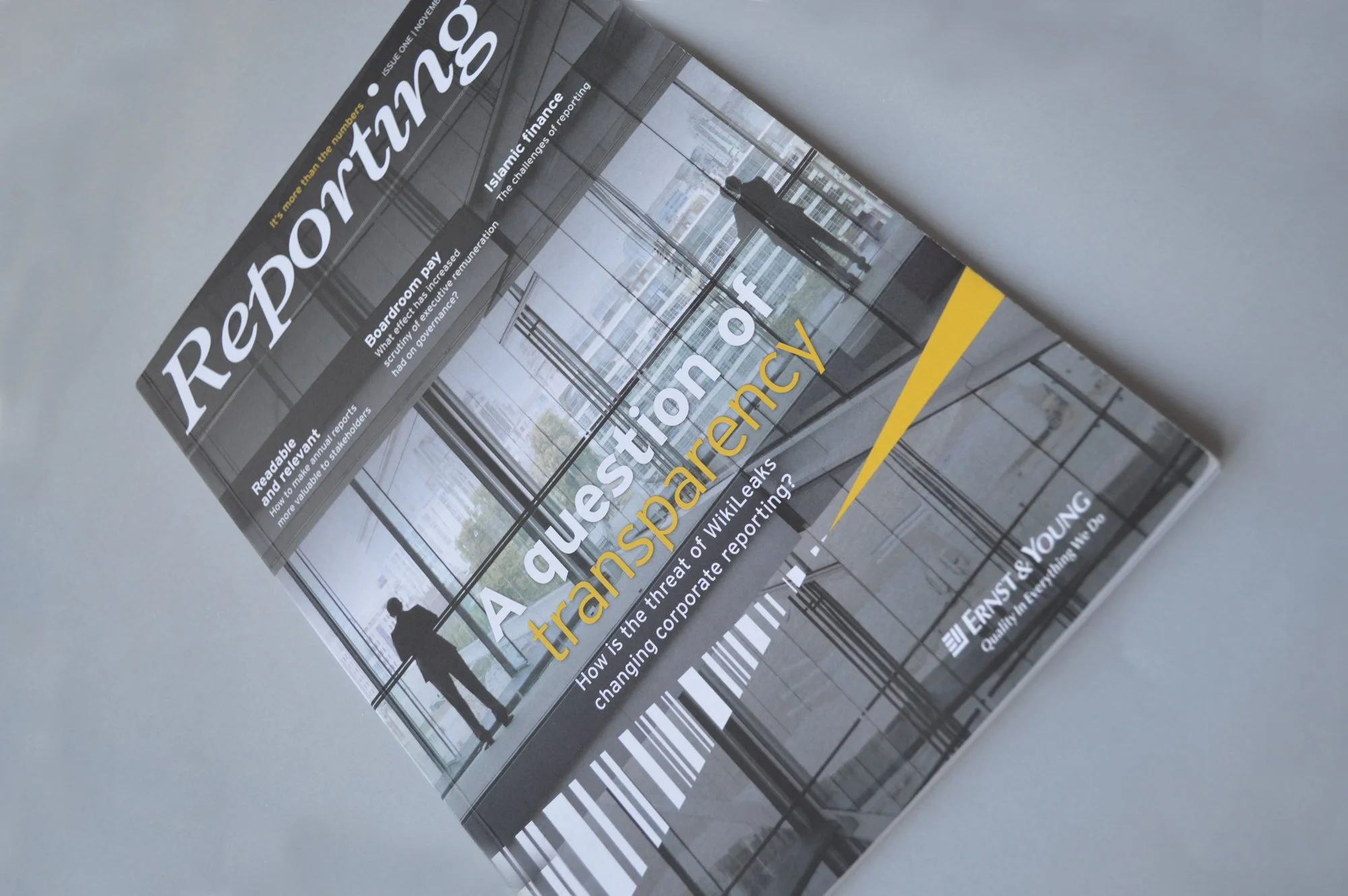 Cover of a report titled "A question of transparency: How is the threat of WikiLeaks changing corporate reporting?" with an image of a person standing inside a modern building with large glass windows.