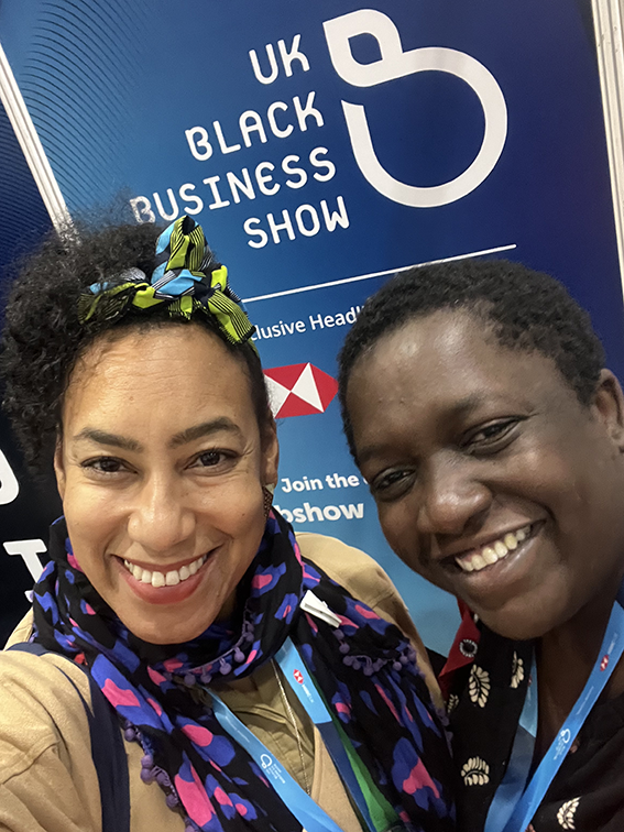 Two women smiling at the camera