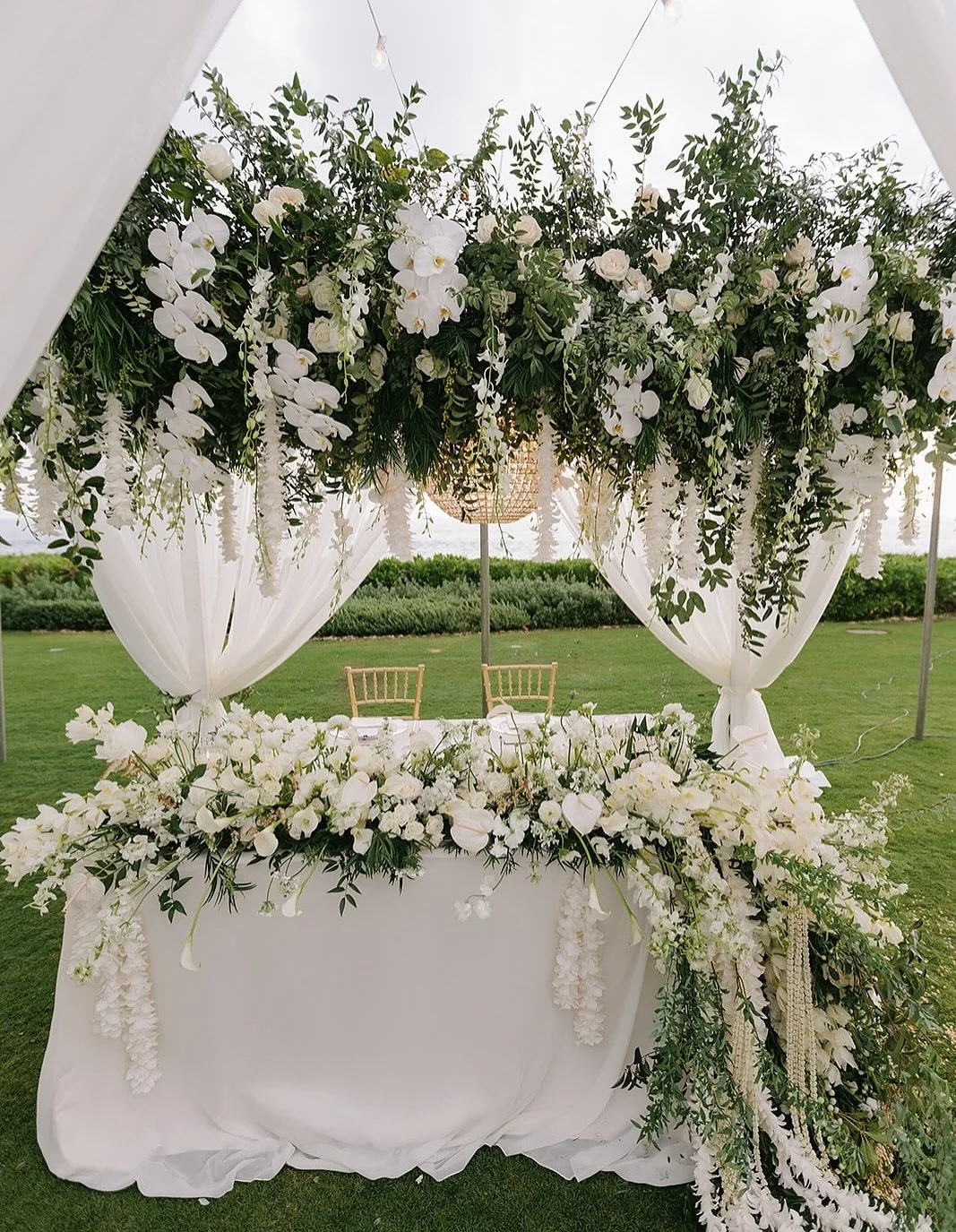 Feels like an Elegant Garden Dream🤩✨💫

Featuring our White Cabana, Glassball Chandelier, White Dance Floor, Gold Flatware 

Vendor Love💕

.
.
Photographer @melialucida 
Planner @fredandkateevents 
Florals &amp; Styling @dbhemingway 
Fabric draping