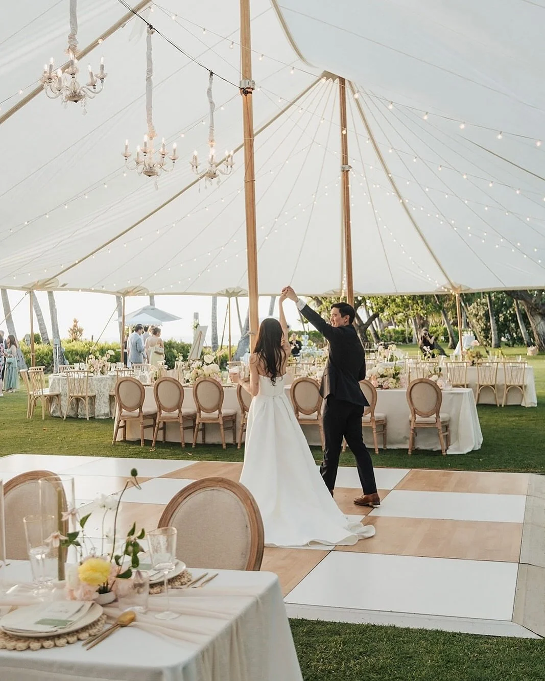 BRB - dreaming about this oh so delicate + dreamy reception design 🌸

Featuring our Sailcloth Tent, Checked Dance Floor, Louis Dining Chairs, Chandeliers, Ivory Heirloom Plates, Gold Flatware Set, Rattan Charger 
.
.
.
Vendors ✨
Wedding Planning + C