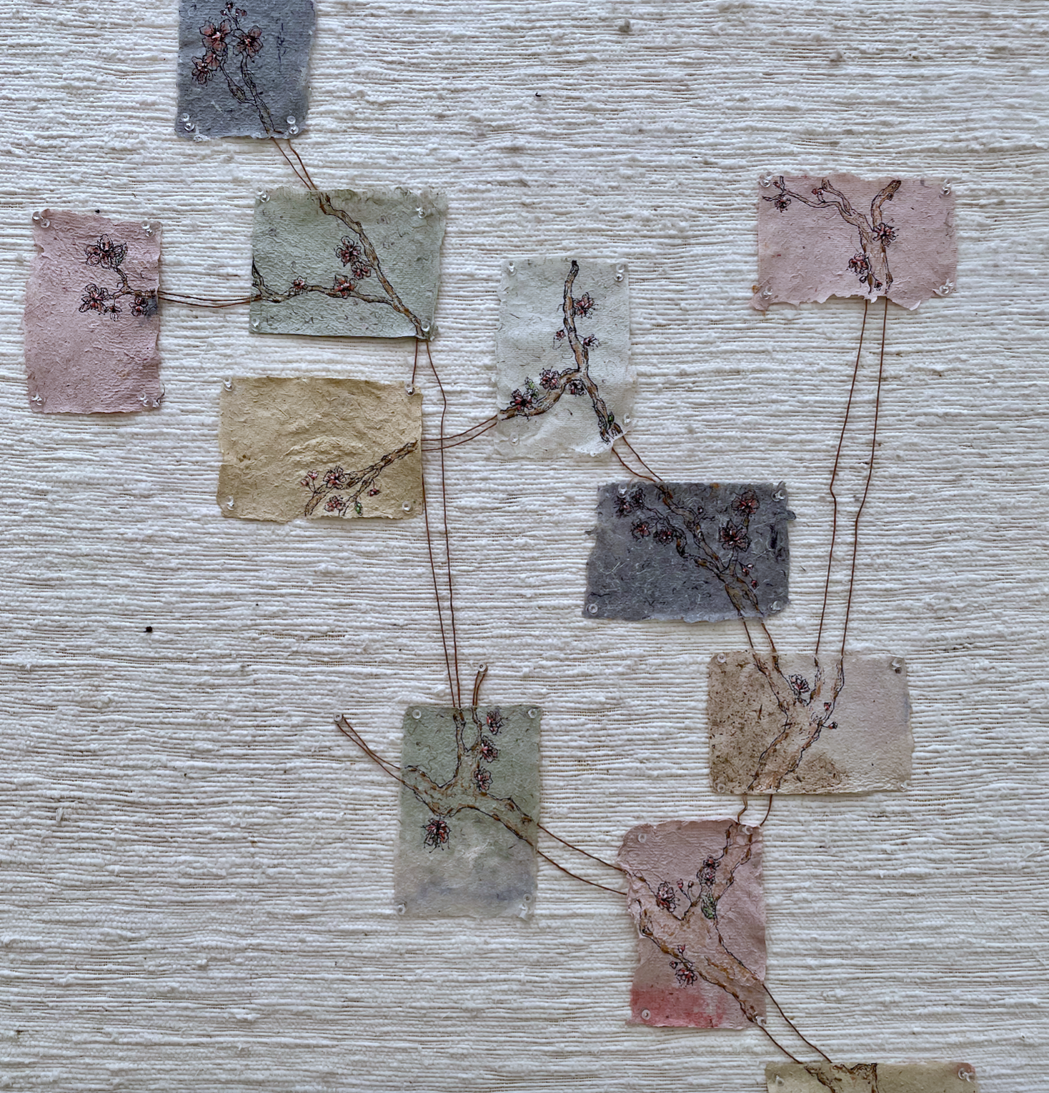 embroidery thread, watercolors, and pen on handmade paper