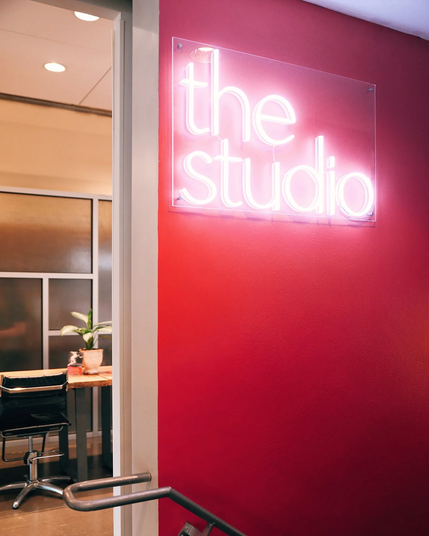 ‘the studio’ neon inside bijin salon & spa in Prairie Village, marks the entrance to the vibrant and trendy studio stylist area.