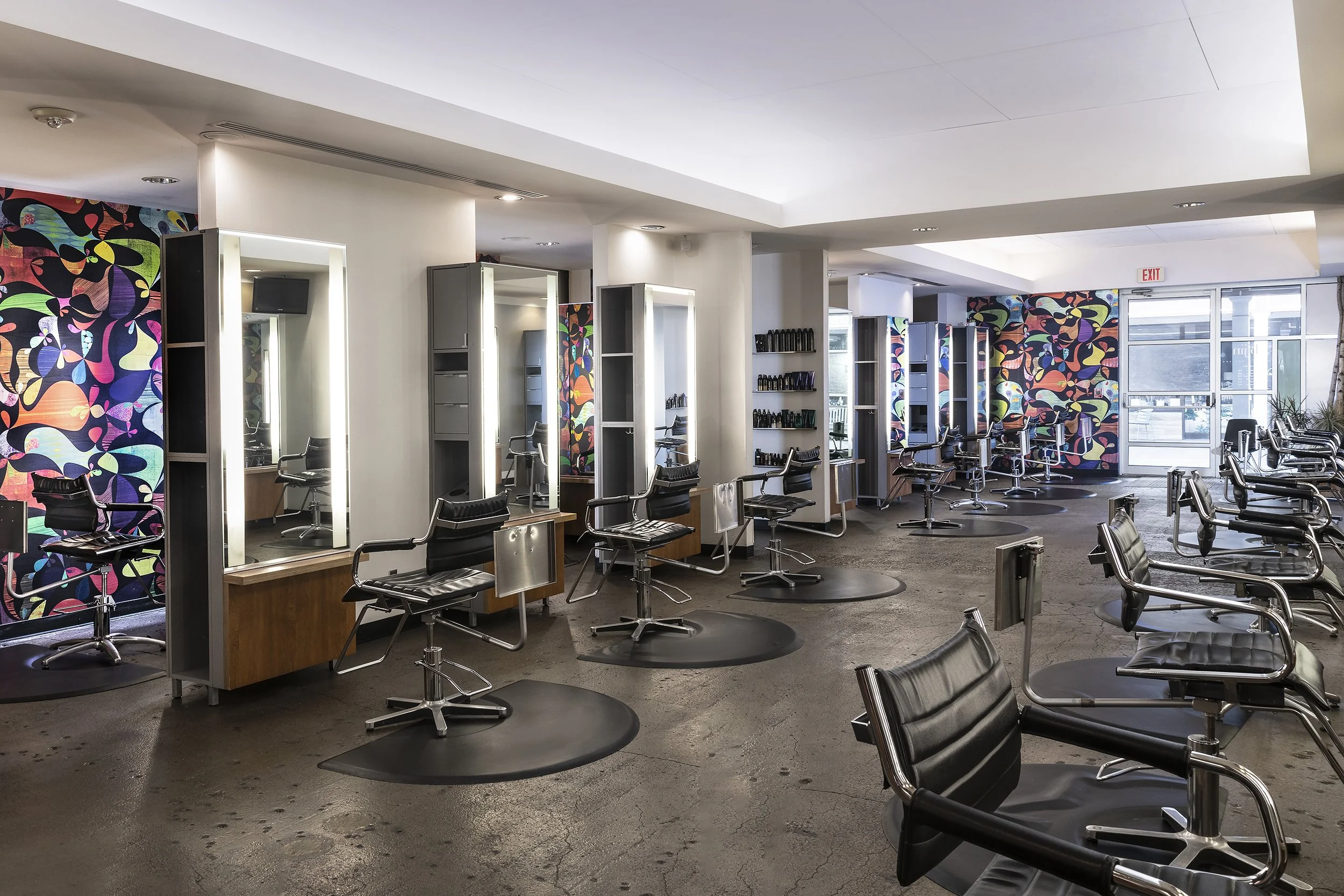 The spacious, modern interior of bijin salon & spa, featuring a luxury hair styling floor in Prairie Village, KS.
