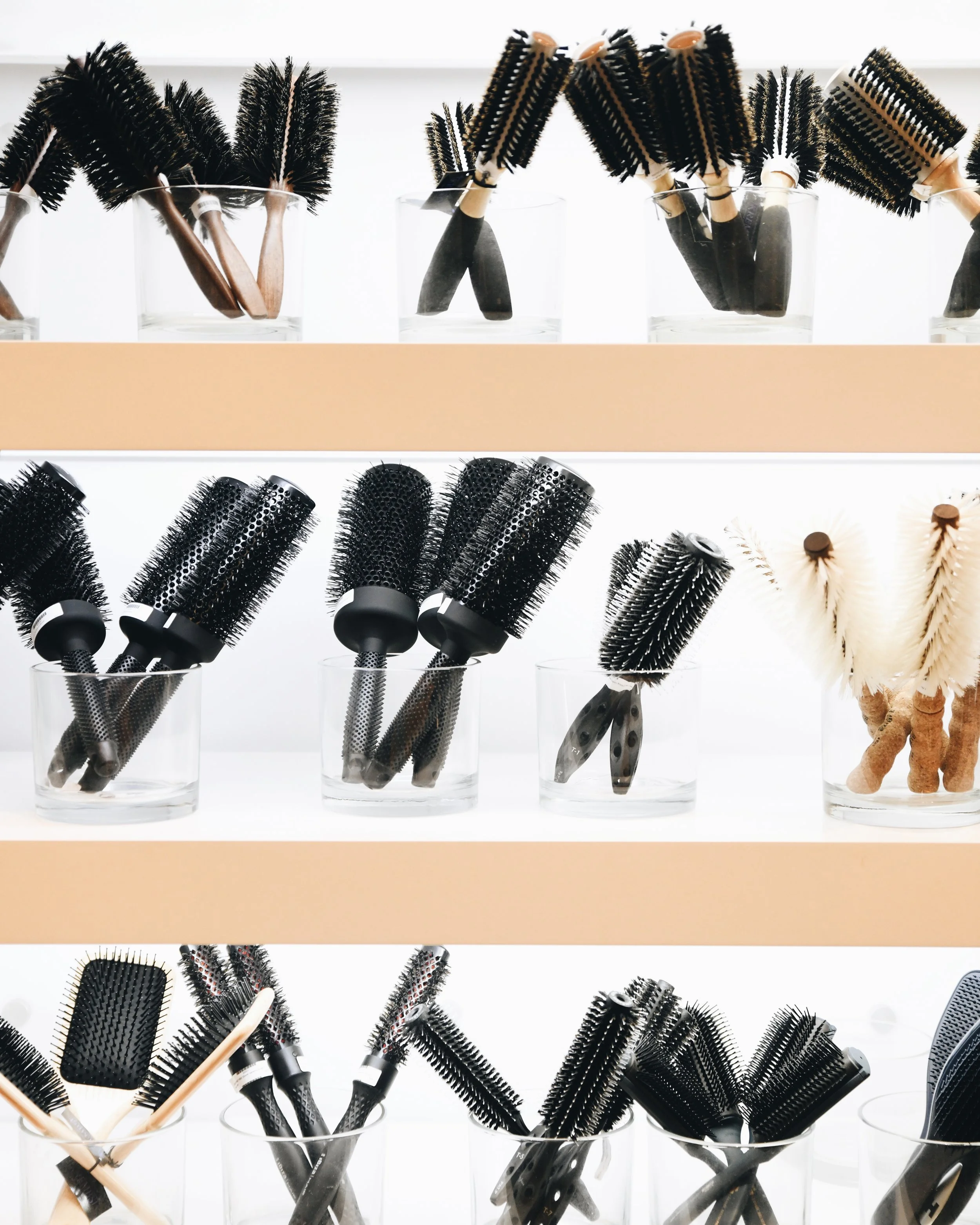Wide range of luxury haircare and styling hair brushes available for purchase at the shop at bijin salon & spa located in Prairie Village.