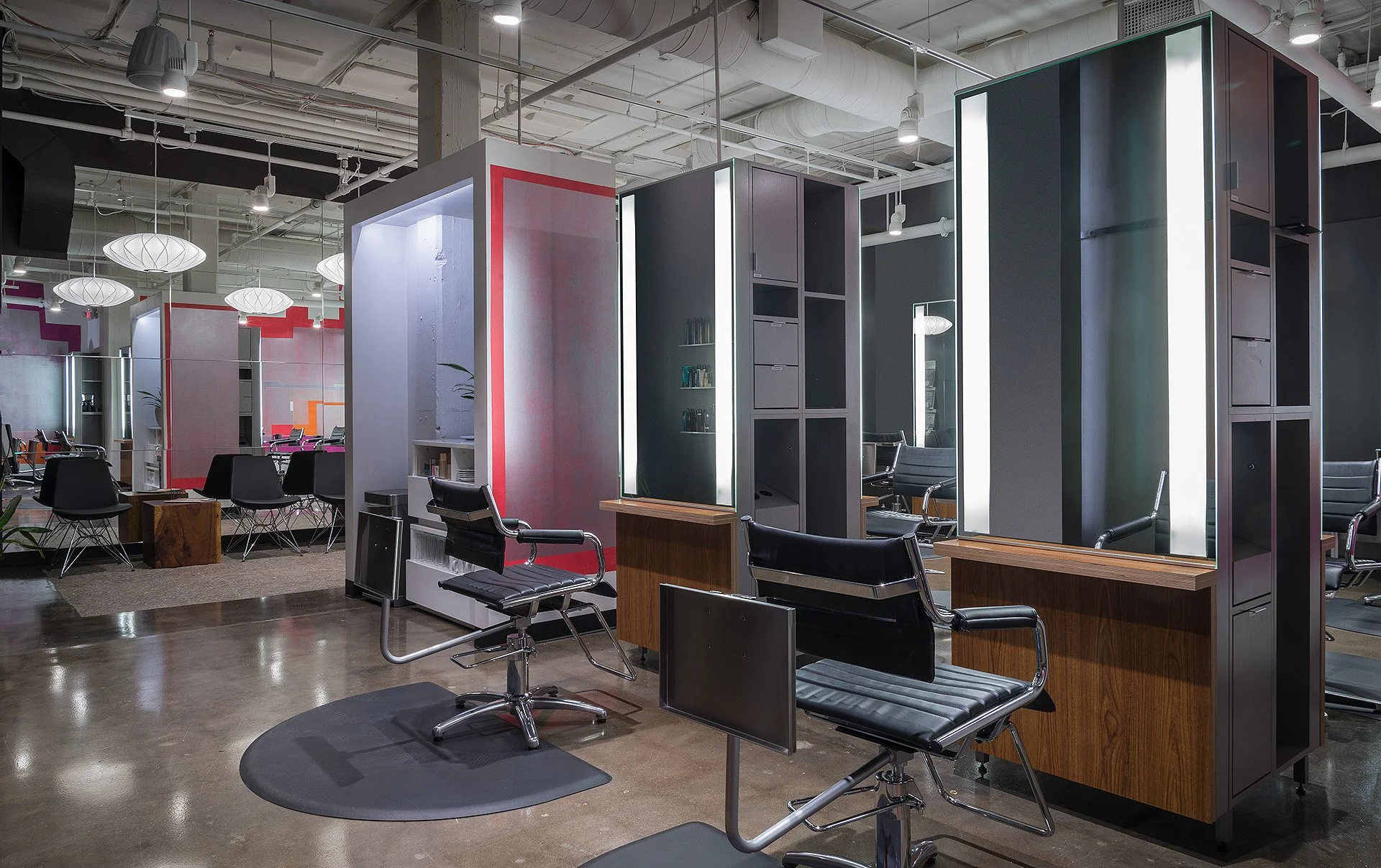 Sleek and contemporary hair styling stations with optimal lighting for quality color, cut and styling services in the studio at bijin salon & spa in Kansas City.