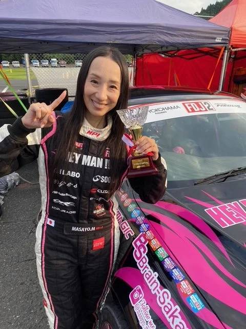 Minowa with trophy.jpeg