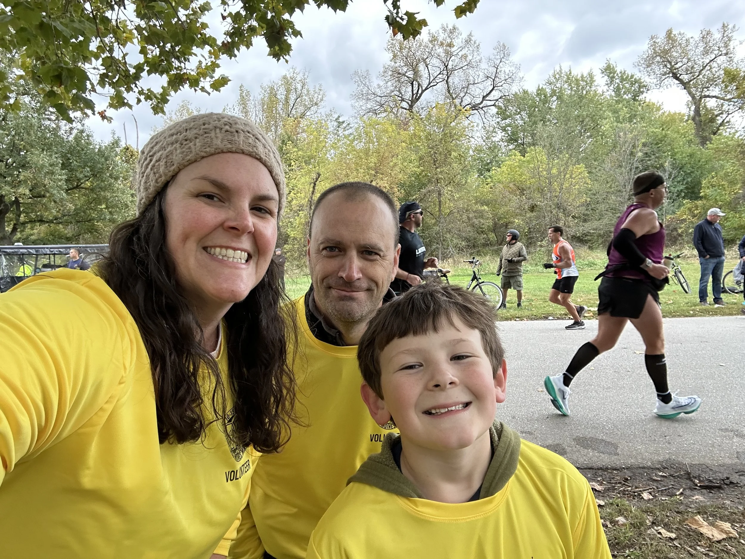 Close-up of Deborah and her family wearing yellow shirts.