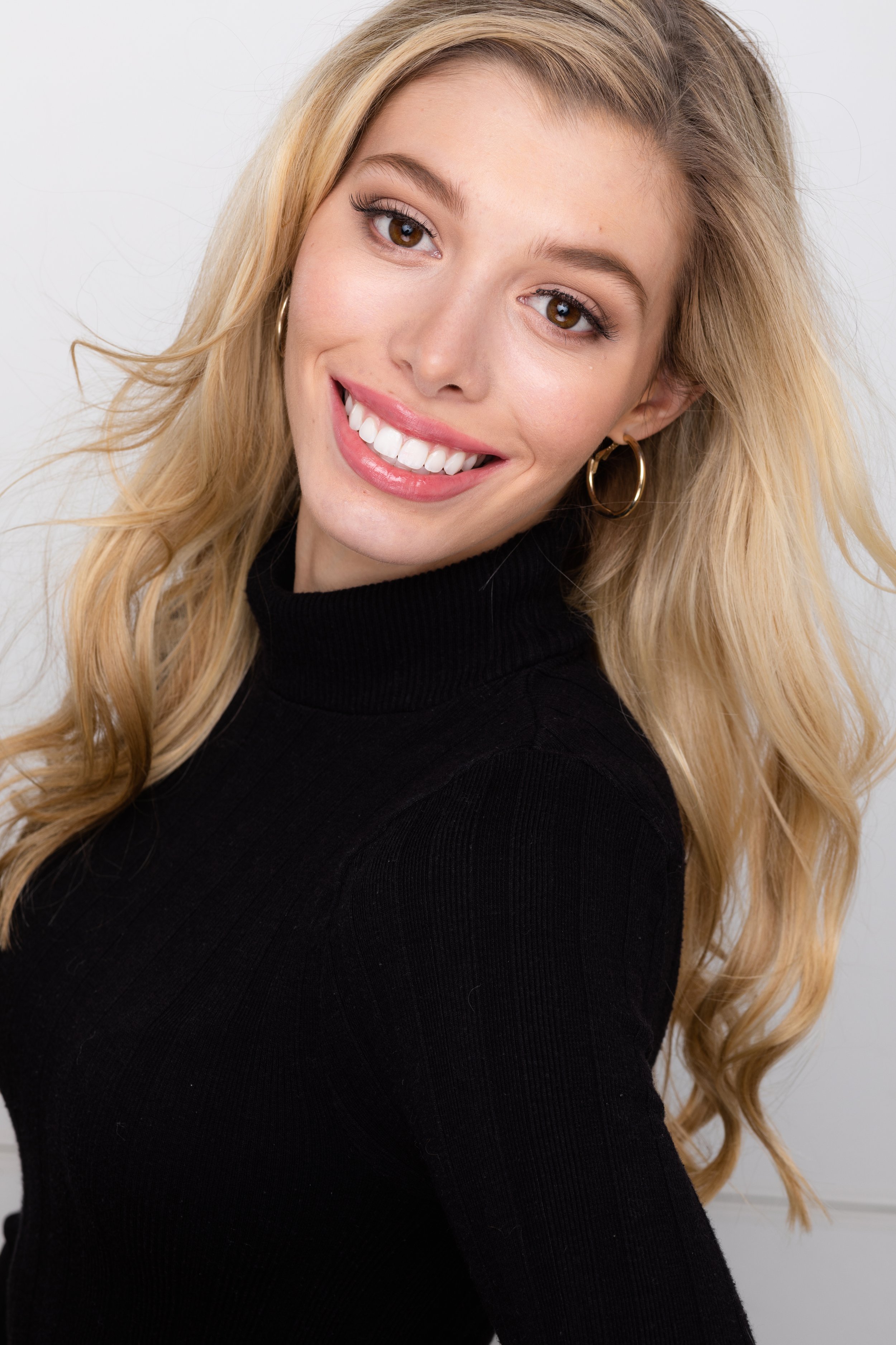 Headshot Hair and Makeup. Very soft glam makeup with light curls in hair.