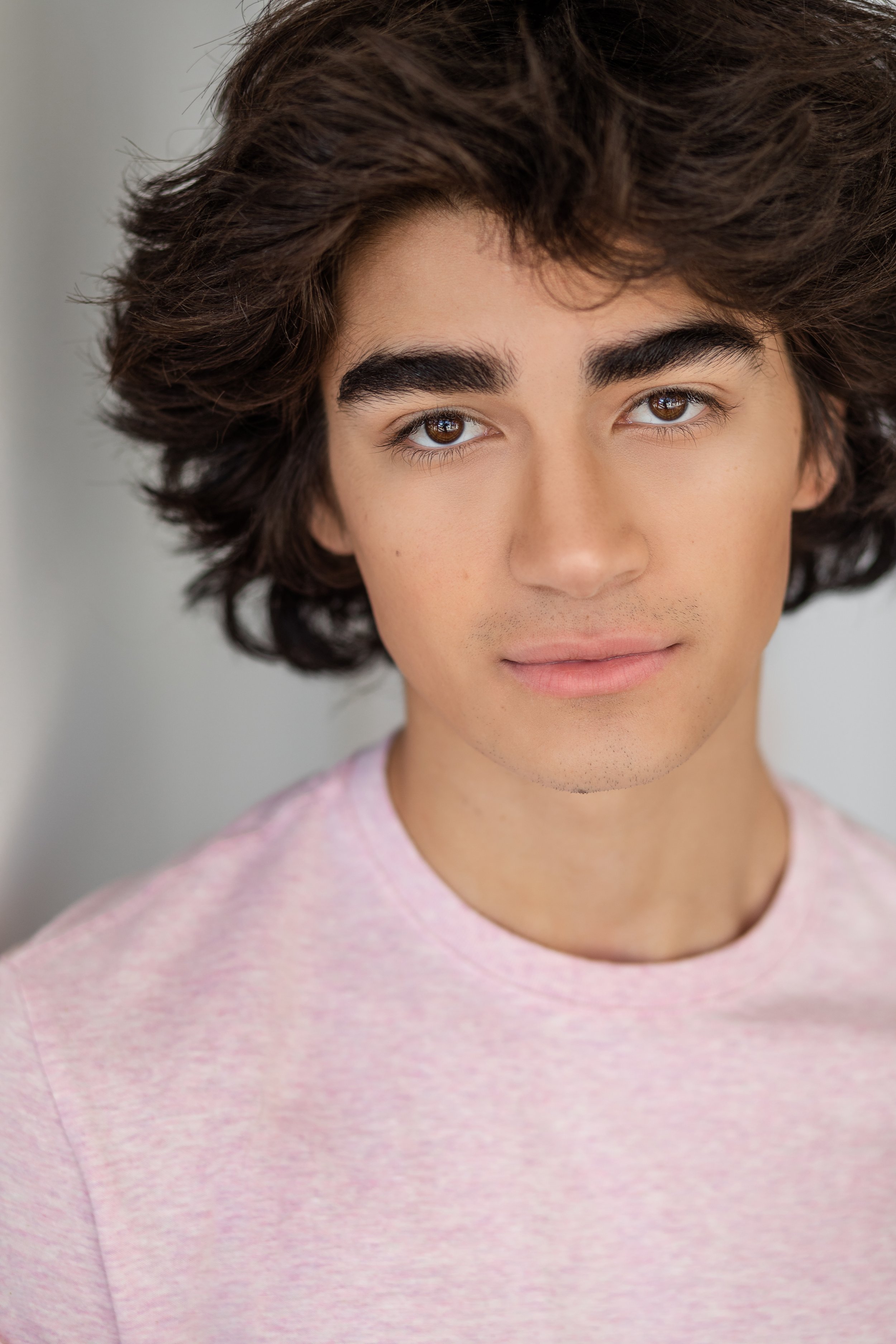 Headshot Hair and Makeup. Evened out skin tone, natural body with spray in hair.