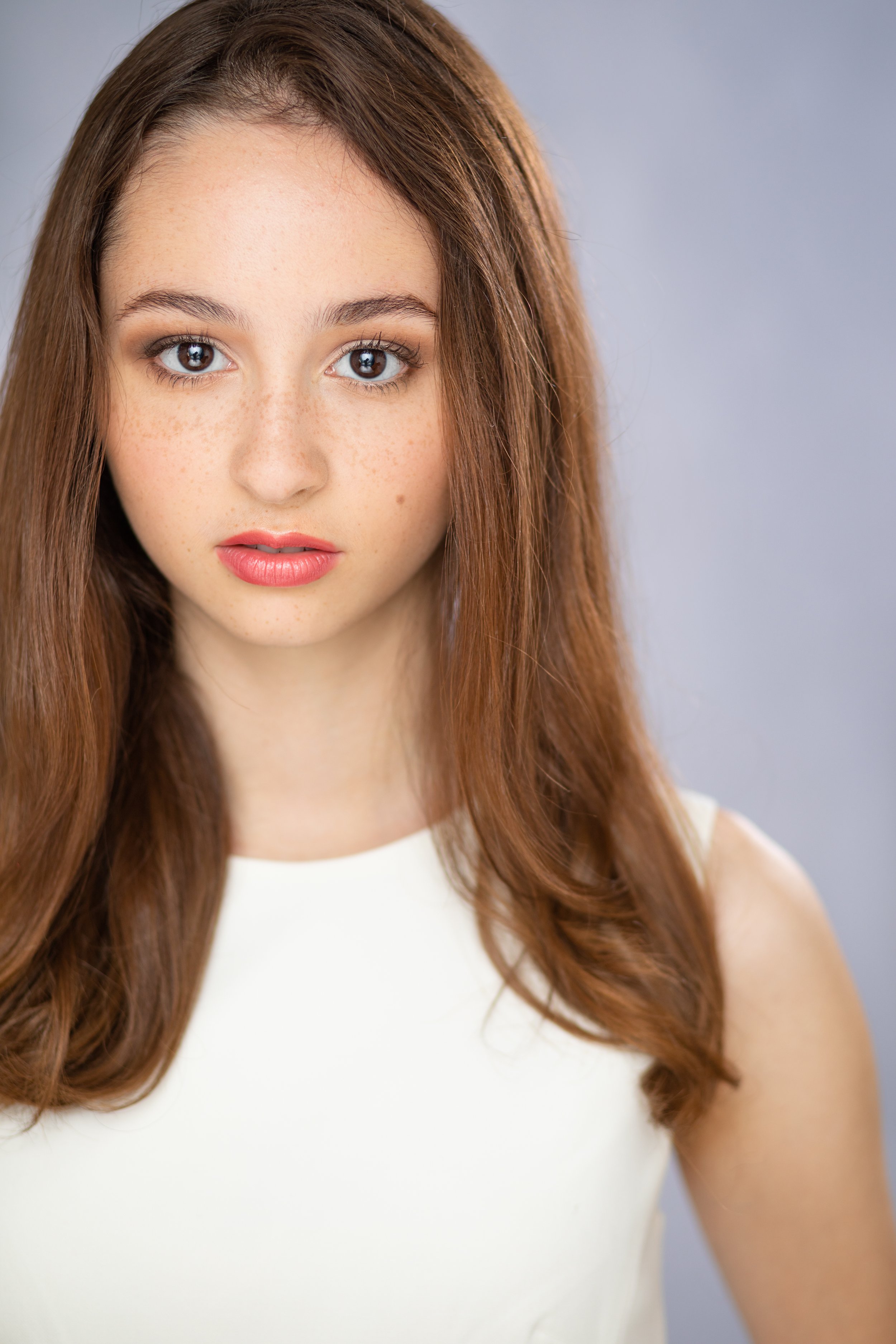 Headshot Hair and Makeup. Light makeup with a pop of lip color. Styled with a Flat iron.