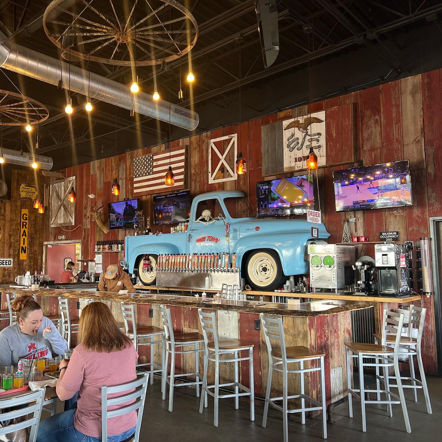 With a truck as a backdrop, wagon wheel chandeliers, and even keg tap bathroom faucets, the vibe at @barntownbrewing really couldn&rsquo;t get much cooler. We had a blast here while in Des Moines - read about our visit in depth on the blog in our bio