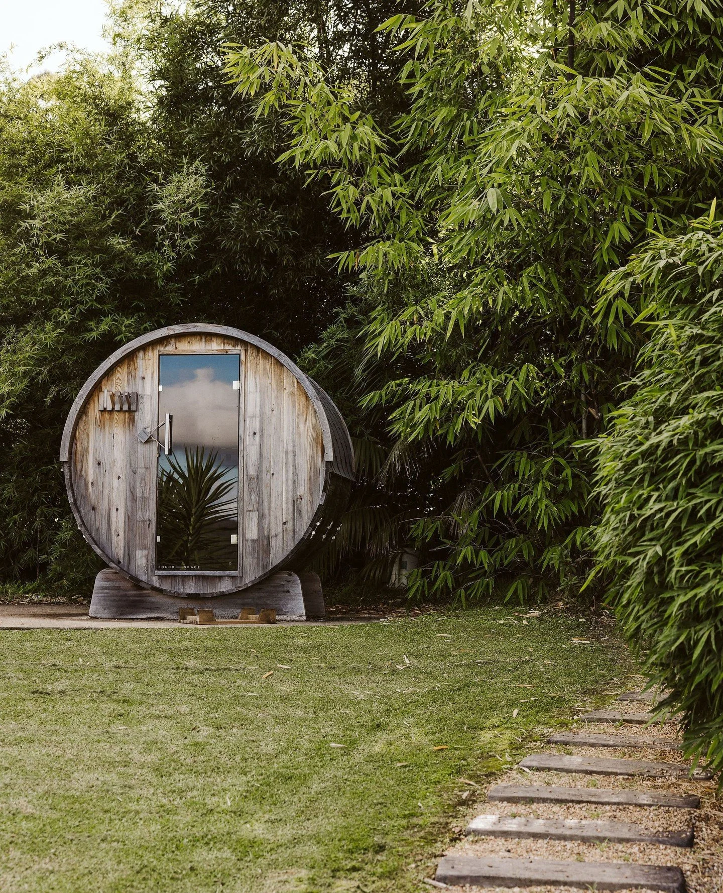 An outdoor oasis designed for pure relaxation. This cedar sauna sits nestled amongst mature Bamboo for natural privacy, with a glass door perfectly positioned to take in the views. A peaceful retreat right at home.