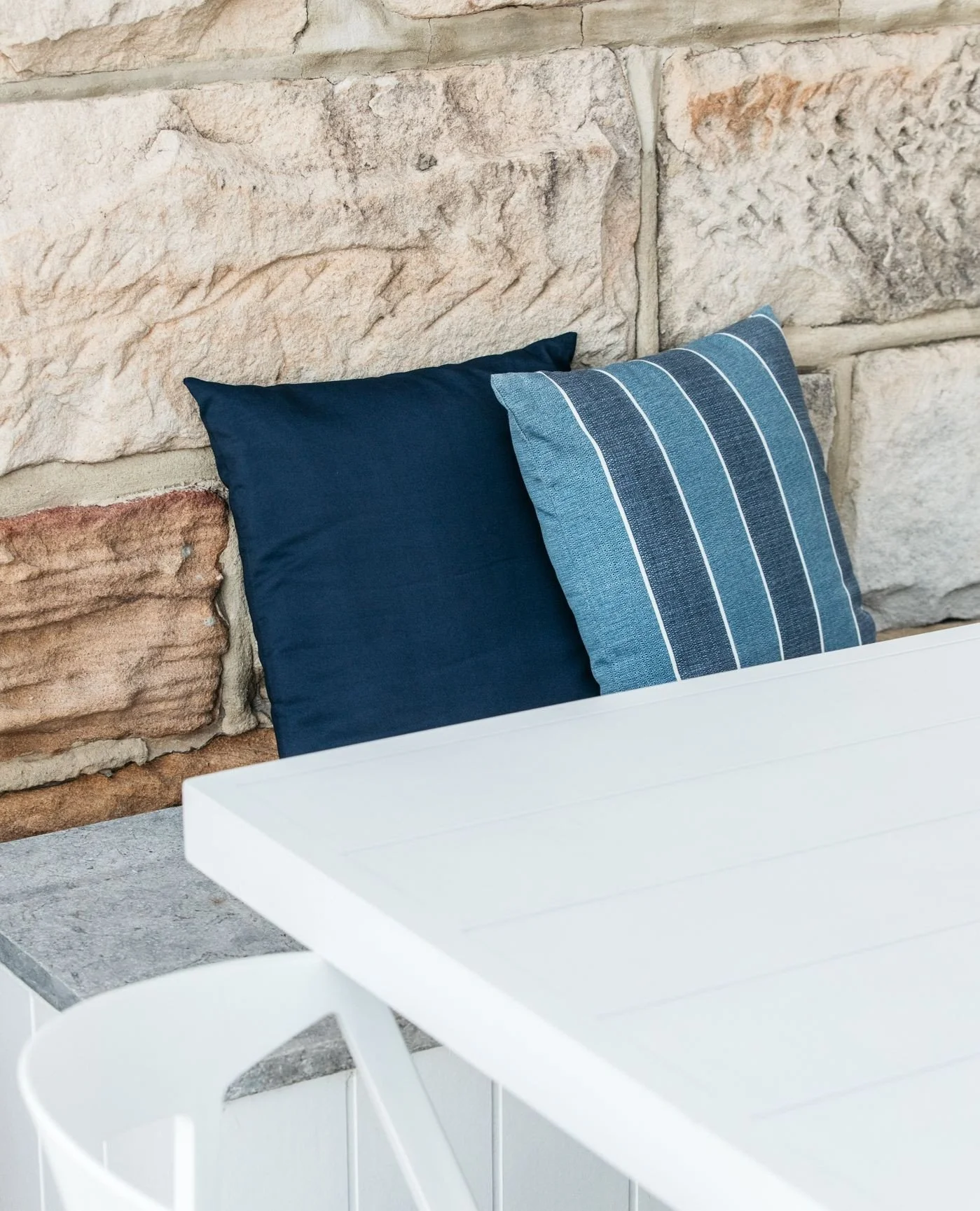 A complementary material palette was selected using neutral colours and textures, allowing the existing sandstone walling to remain the visual feature. Its natural patterning and warm tones provide depth and character, while the surrounding materials