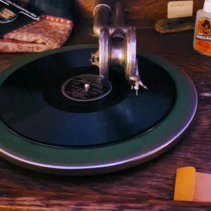 Tree decorating tradition with 78s on the victrola.