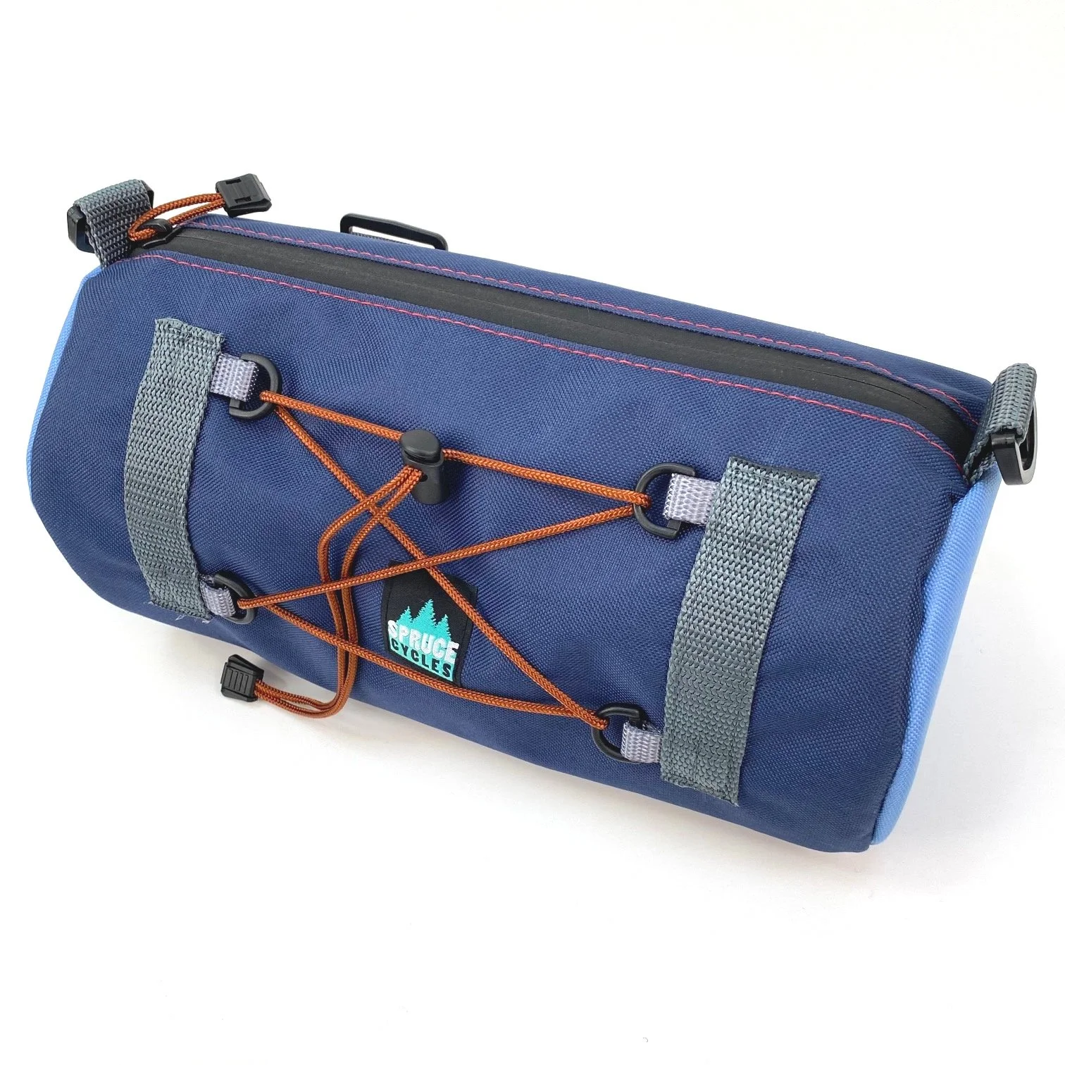 A blue cylindrical bicycle saddlebag with grey straps, orange bungee cord, and a 'Spruce Cycles' logo, isolated on white background.