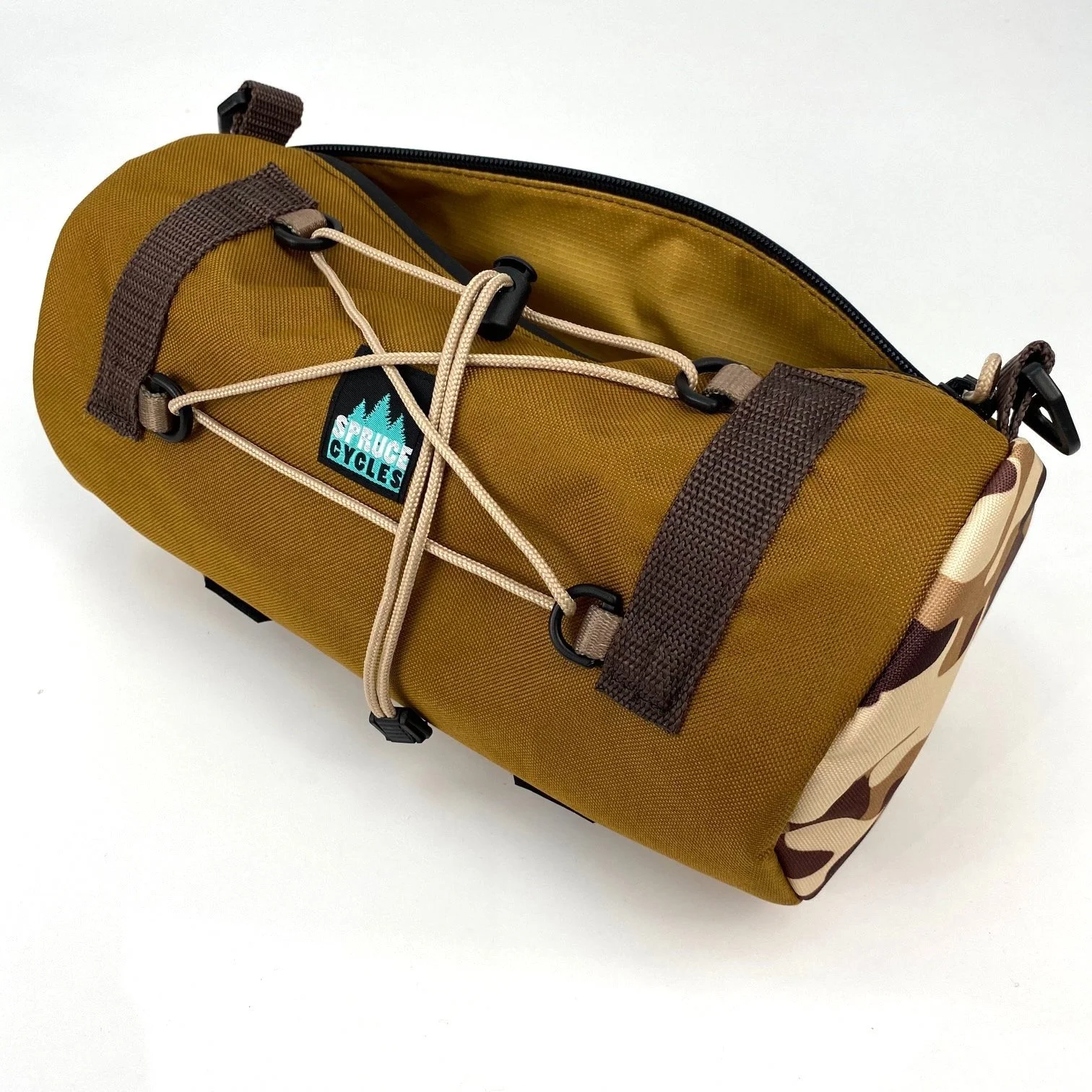 A brown and camouflage sports water bottle holder with a logo that says 'Pressure Cycles', featuring a mountain and pine tree, with a beige elastic cord and black clips on a white background.