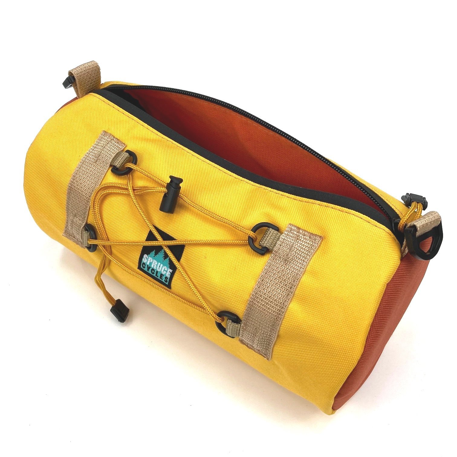 Yellow and brown bike handlebar bag with orange interior and external bungee cord.