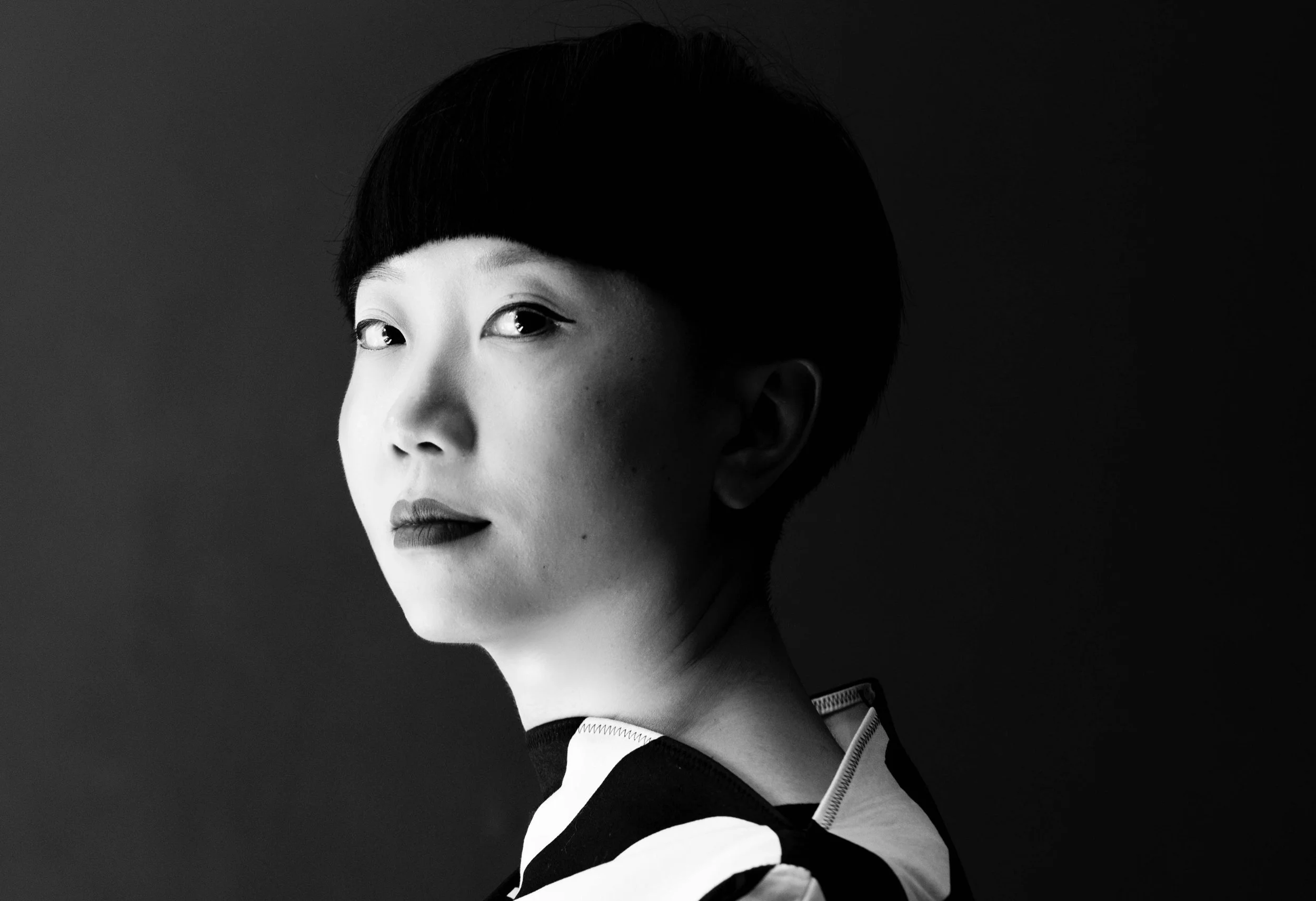 Black and white portrait of JiaJia Fei wearing a black and white dress