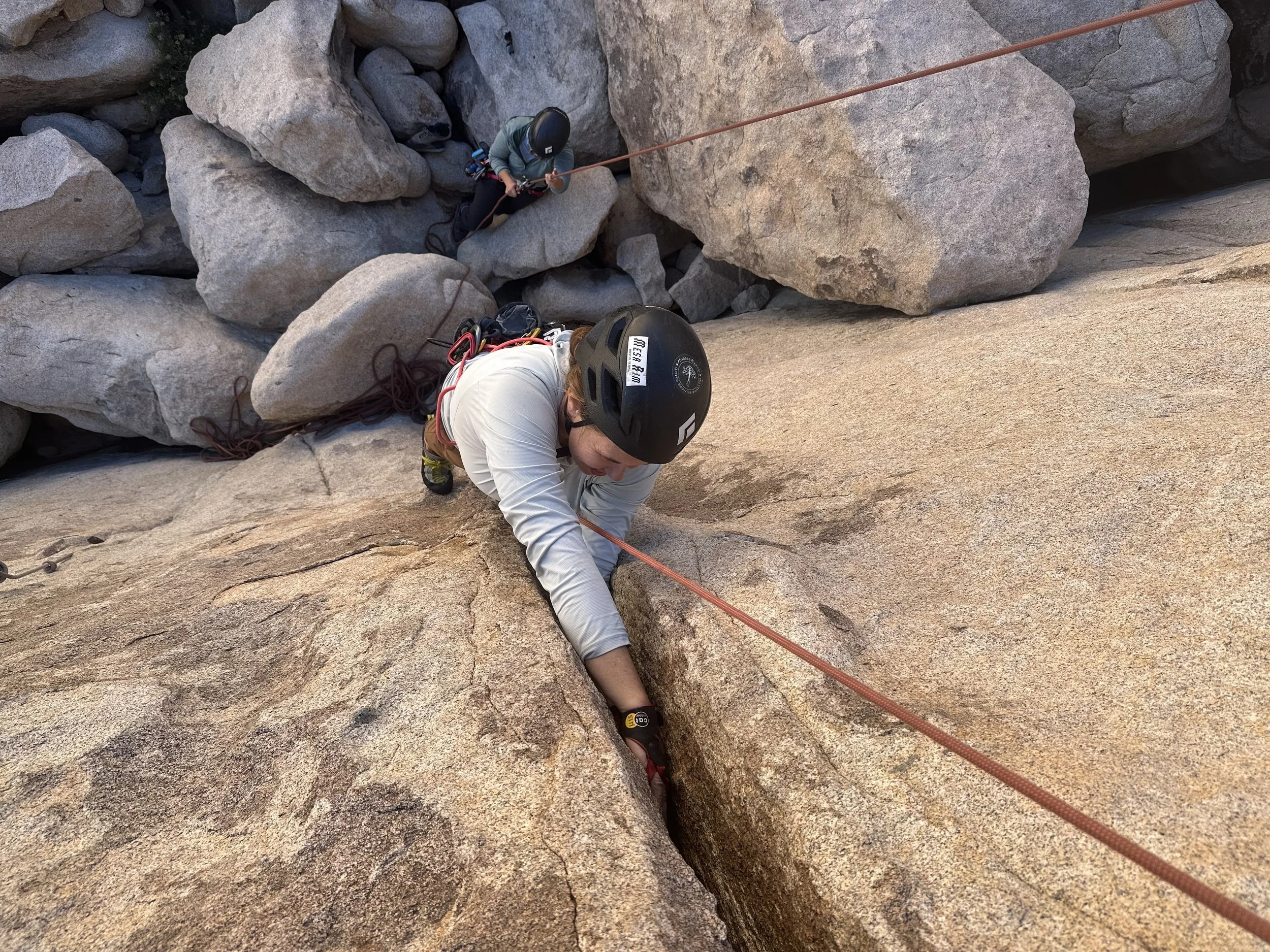 A climber learning how to hand jam in Joshua Tree