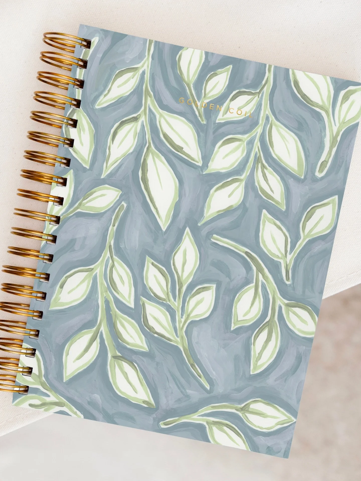 Hand-painted leaves, wispy, imperfect and messy. Brushstrokes and blobby bits, created by a human. 

My entry for the @golden.coil planner cover design contest. 

#GCxDESIGN26 

Acrylic on paper, botanical painting, surface design, pattern design, il